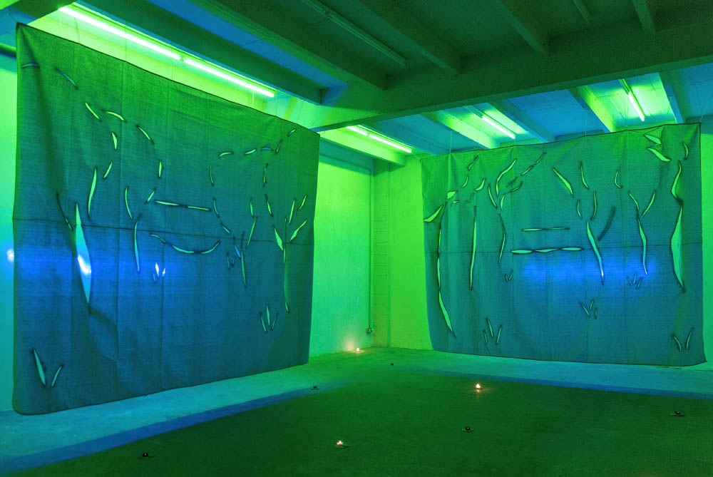 Un coucher de soleil, 2014, Spray paint on canvas, light gels, LED light cables, clay, candles, Dimensions variable. Installation view at Exo Exo, Paris, FR