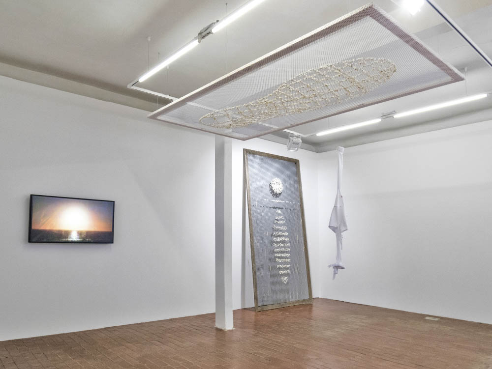 Tastes like headaches, 2017, Popcorn in mesh, make-up and ruffled cuff on shirt, Dimensions variable. Installation view at kim?, Riga, LV