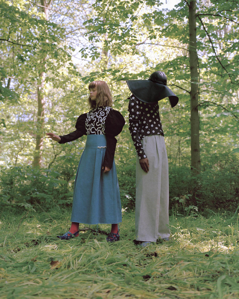 Maja wears top J.W. ANDERSON skirt MOTHER OF PEARL shoes TOGA PULLA . Jamil wears hat J.W. ANDERSON top SHIORI SUZUKI scarf ARE YOU pants KING & TUCKFIELD shoes TOGA VIRLIS