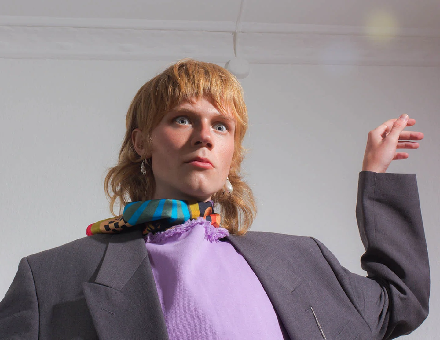 Louie wears jacket PLAÎN dress BLANCHE necklace BJORG JEWELLERY scarf STINE GOYA earrings STYLIST’S OWN