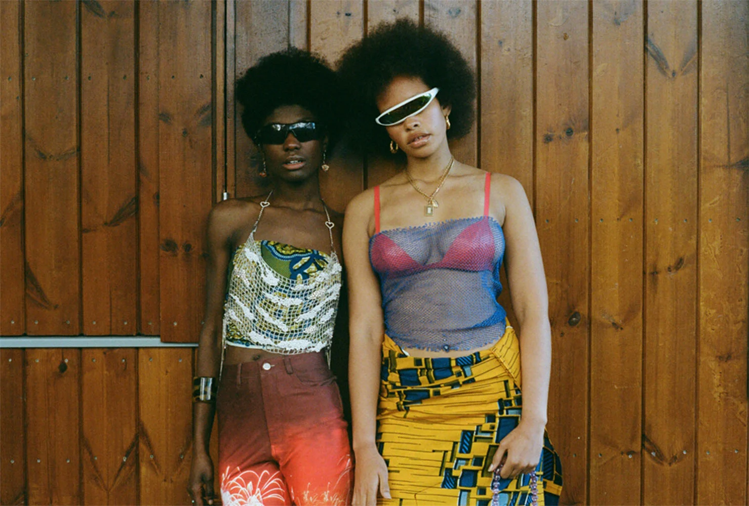 sunglasses STYLIST’S OWN top NIGERIAN ANKARA beaded top CLIO PEPPIATT earrings VINTAGE trousers NODRESS bangle VINTAGE . sunglasses STYLIST’S OWN necklace VINTAGE net top STYLIST'S OWN latex bra ELISSA POPPY skirt NIGERIAN ANKARA FABRIC earrings VINTAGE
