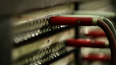 stock-footage-dolly-revealing-an-old-switchboard-hand-reaches-in-and-plugs-in-a-cable.jpg
