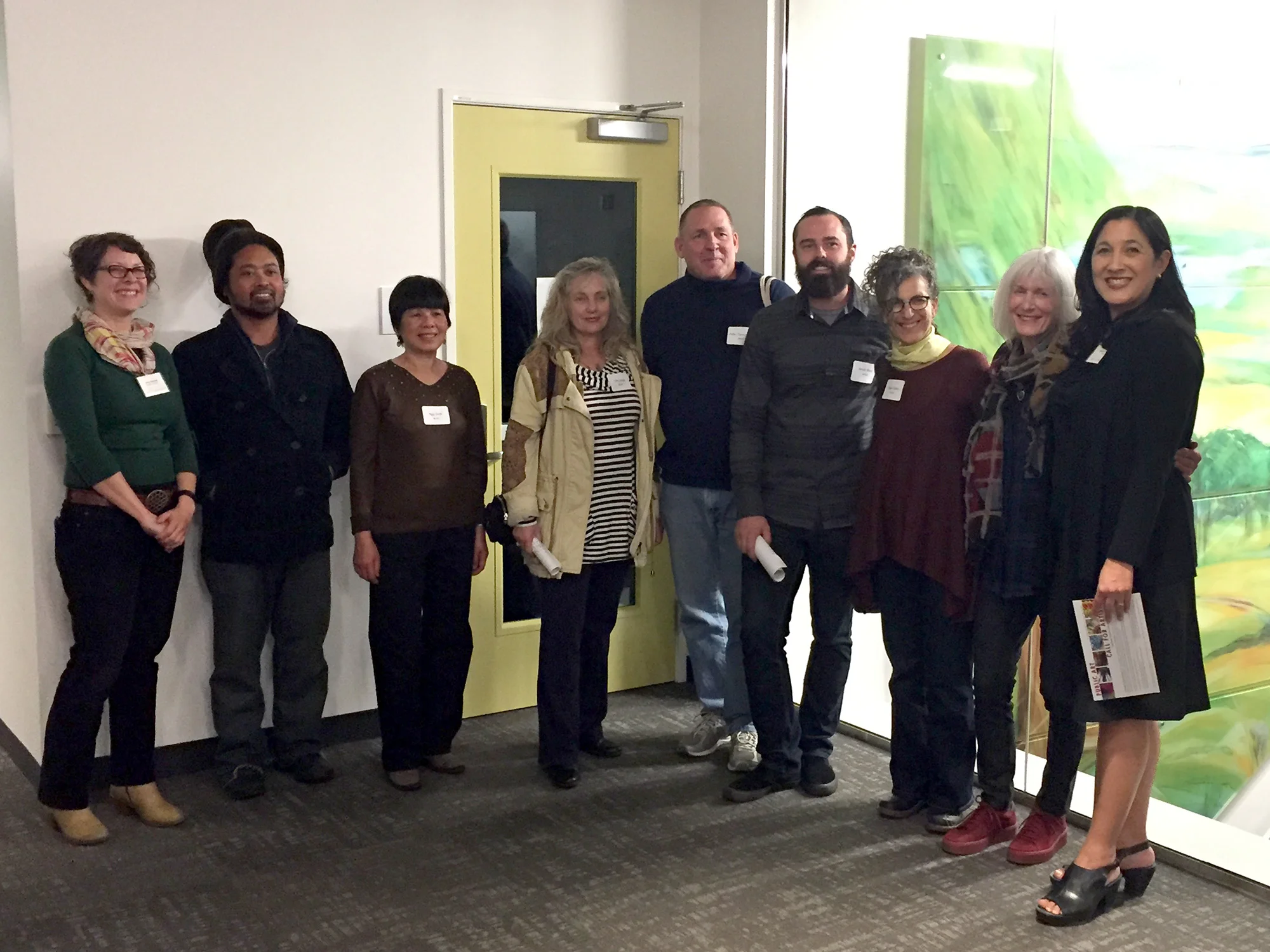 Group shot from the artist building walk-through: From left, Amy Stimmel, Public Art Program Coordinator, a few of the selected artists, and Rachel Osajima, Director or the Alameda County Arts Commission (right).