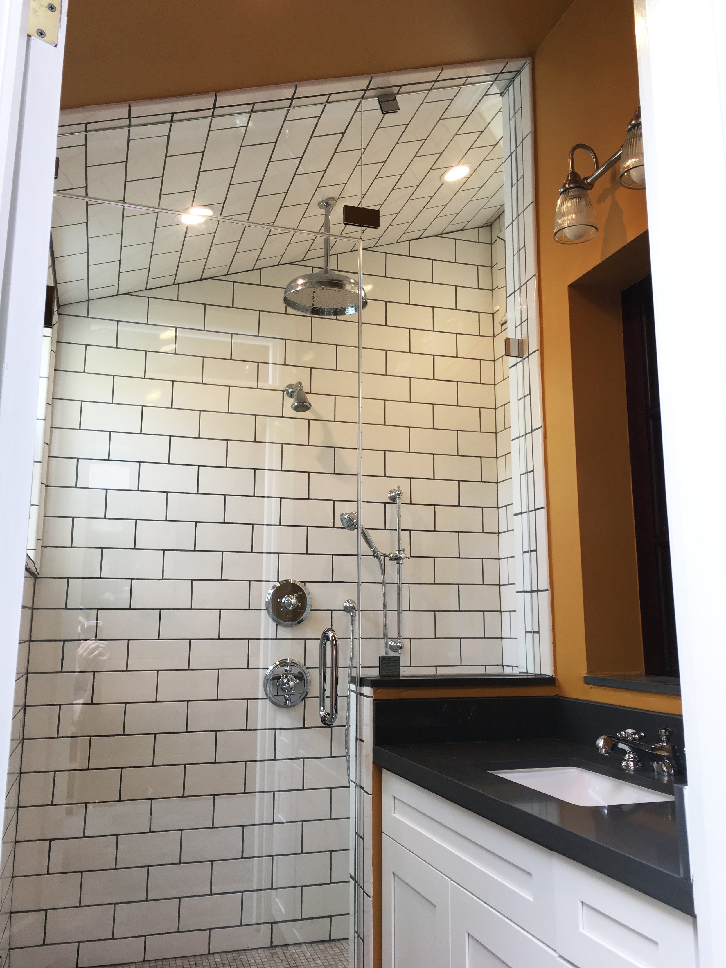 Regency series enclosure using Starphire glass with a non-operable transom. Please note the sloped ceiling.