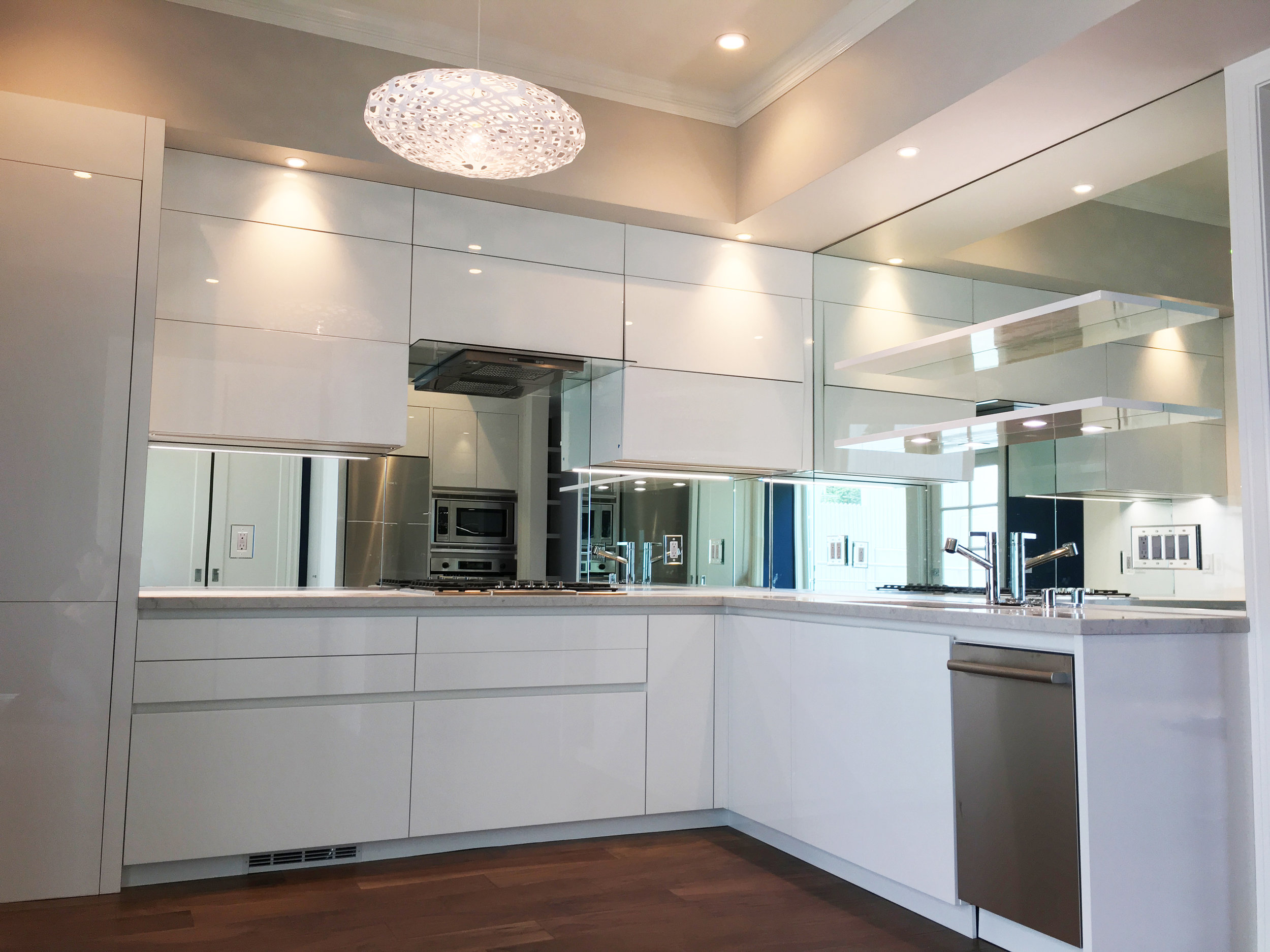 1/4" mirror back splash with mirrored outlet cover plates. 