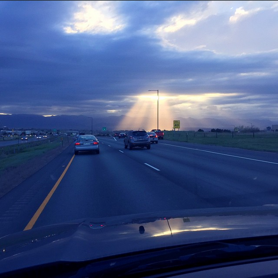 "Sun rays peeking through the clouds tonight"