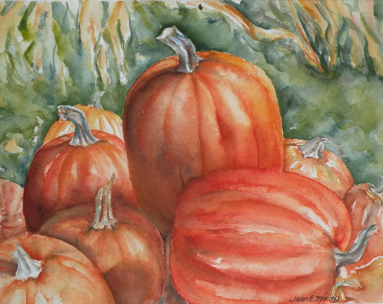 Pumpkins in a field bursting with warm oranges and yellows.