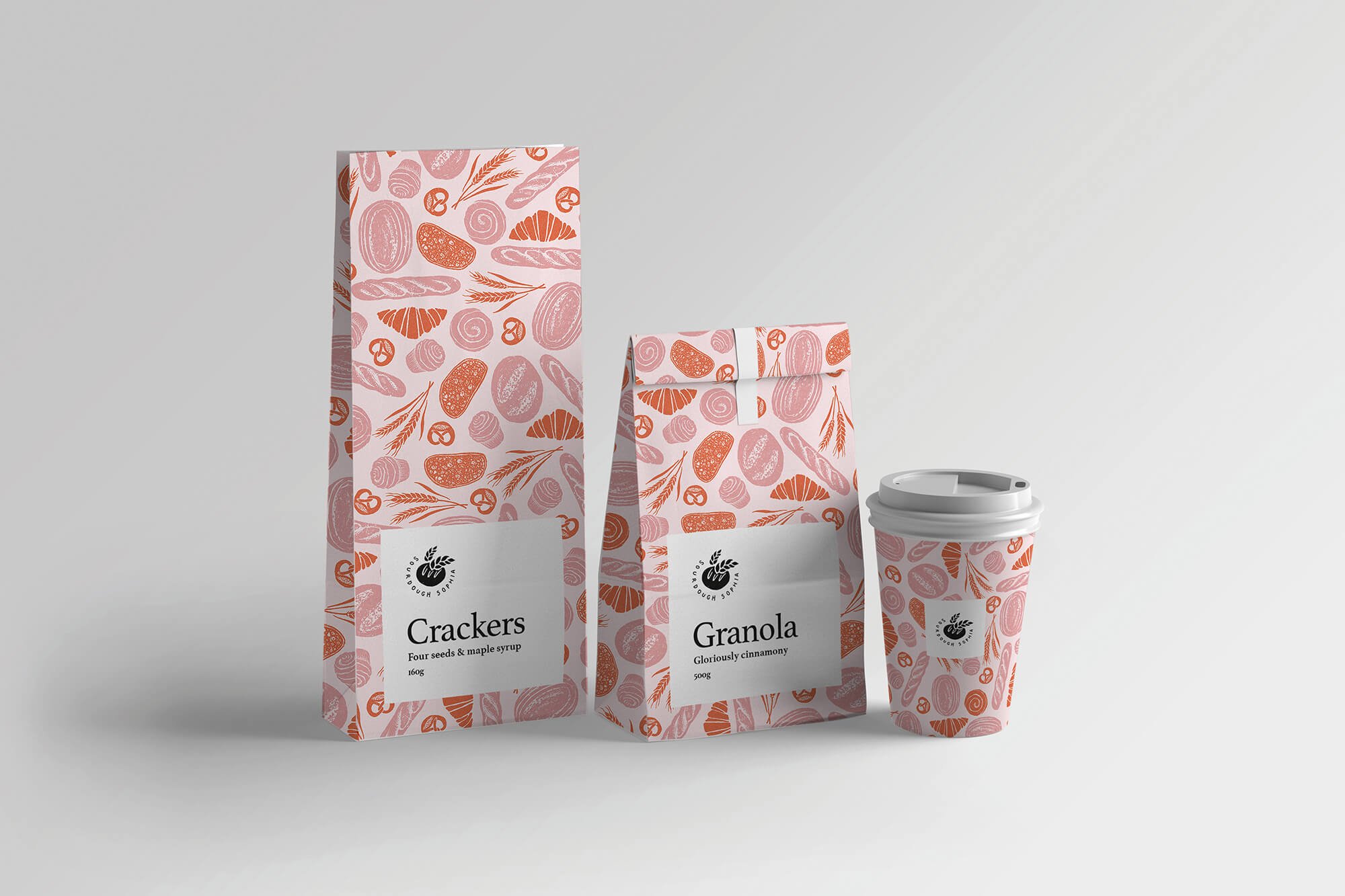  Pattern illustration for packaging for a bakery in pinks and orange with a hand drawn and textured feel. The image is of an illustrated cup design and illustrated bags. 