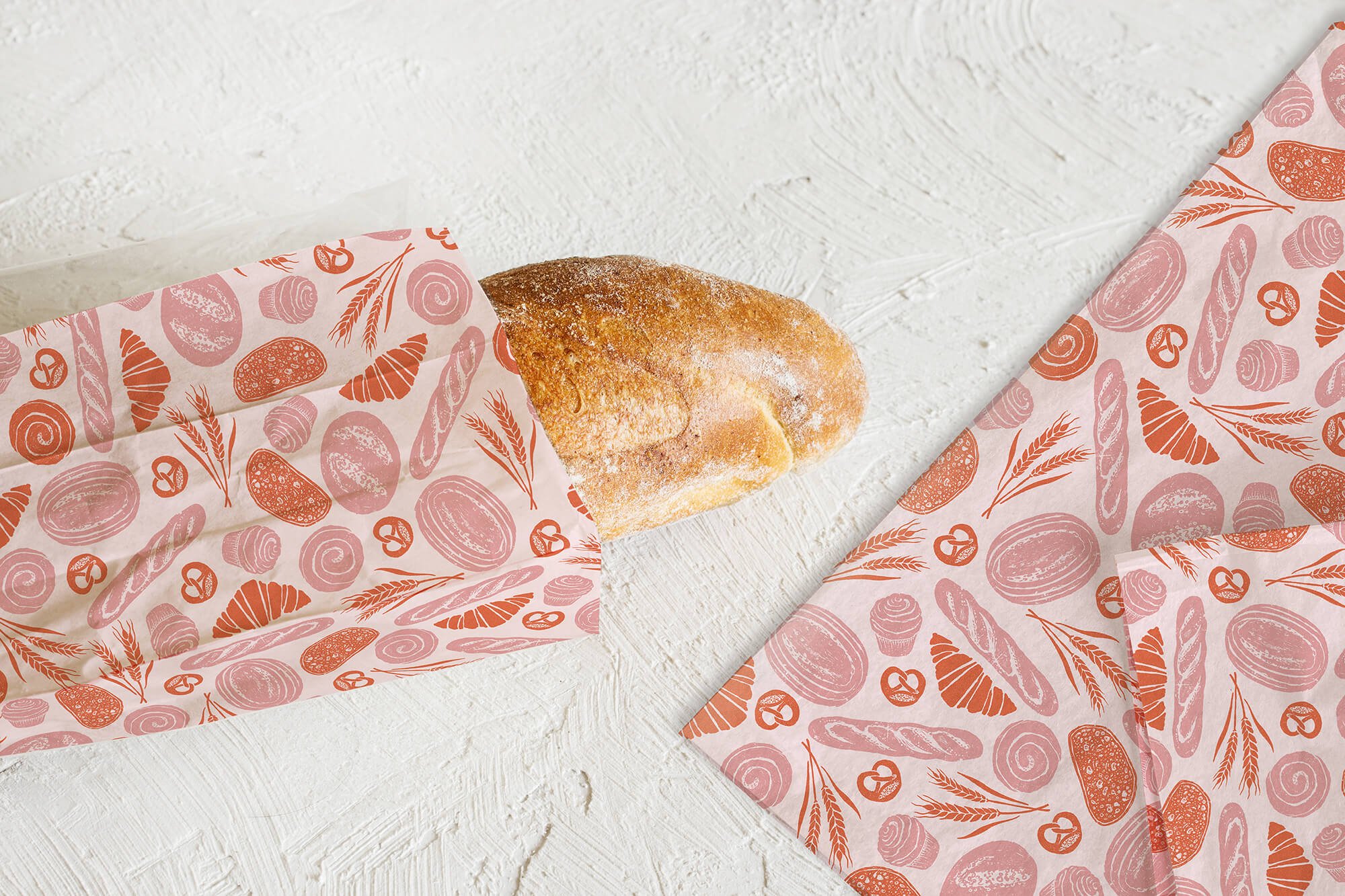  Pattern illustration for packaging for a bakery in pinks and orange with a hand drawn and textured feel. The pattern is on tissue paper to wrap around bread. 