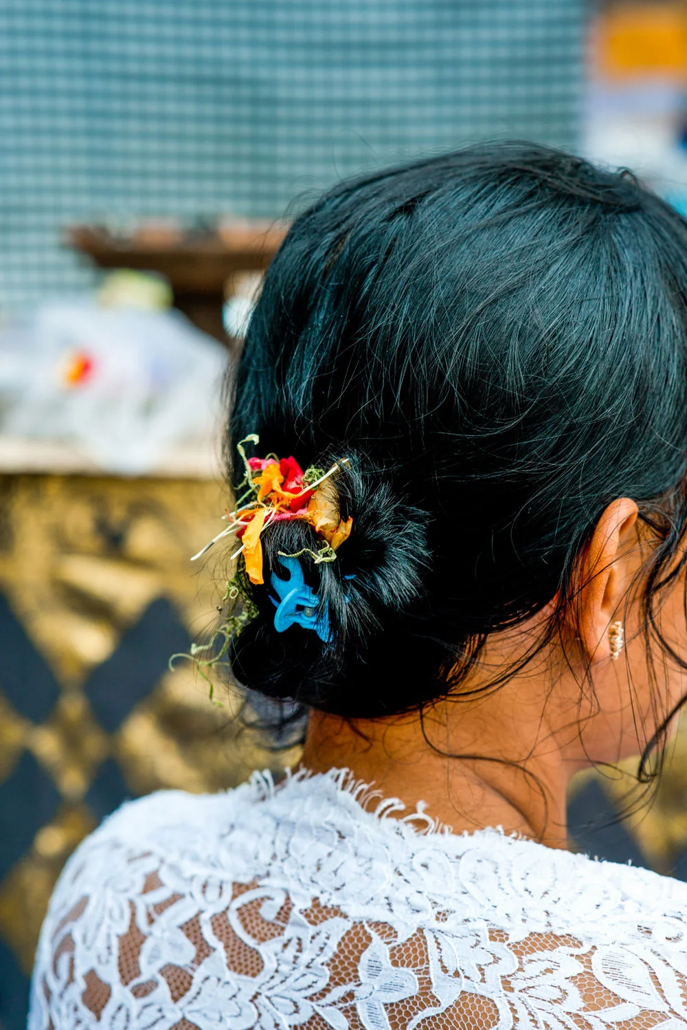 A paradise where women of all ages wear flowers in their hair.