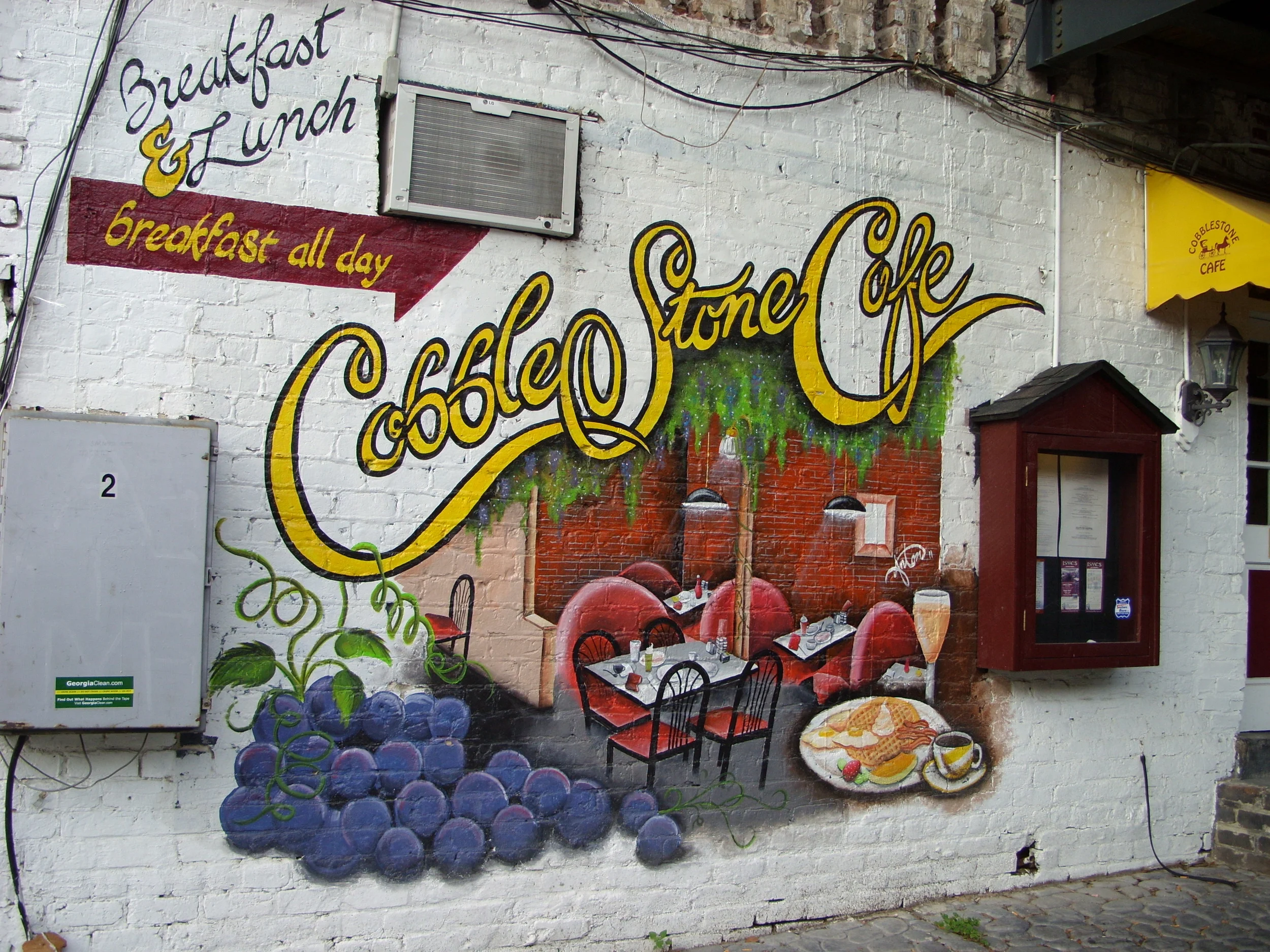  The mural on the wall of Cobblestone Cafe on River Street. 