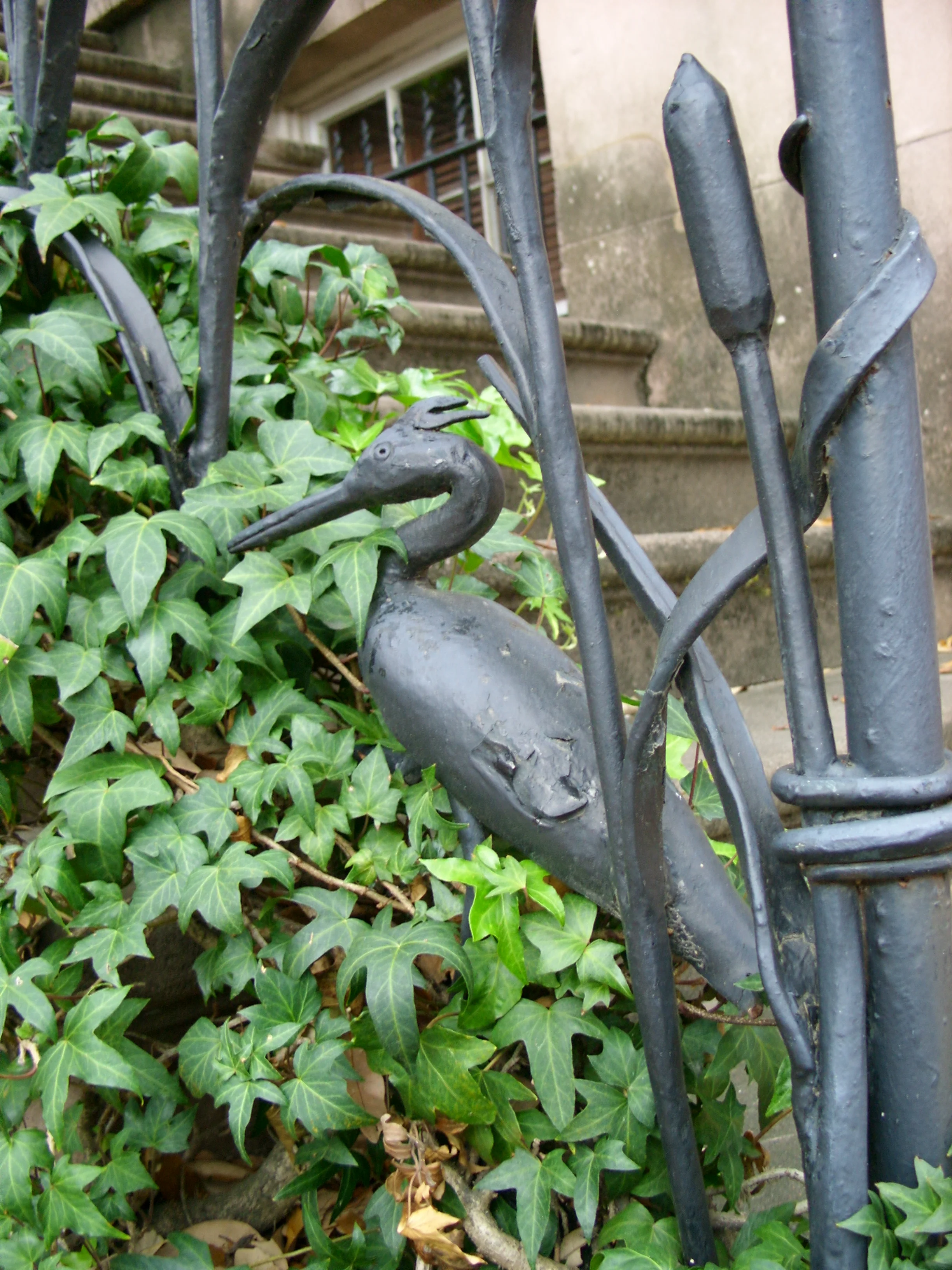  An iron egret at the front stairs of a house on Jones Street. 