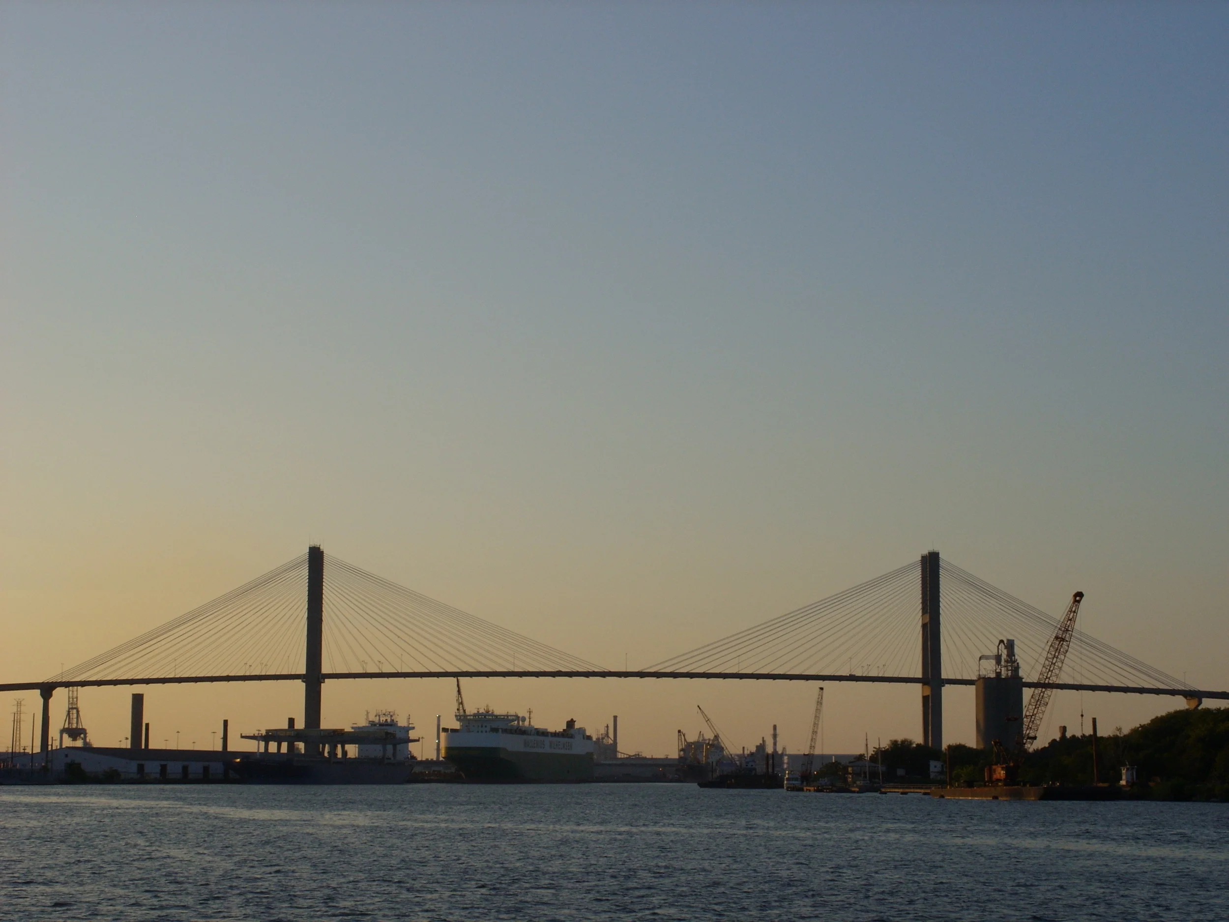  A view of the Talmadge Bridge stretching across the Savannah River at sunset. 