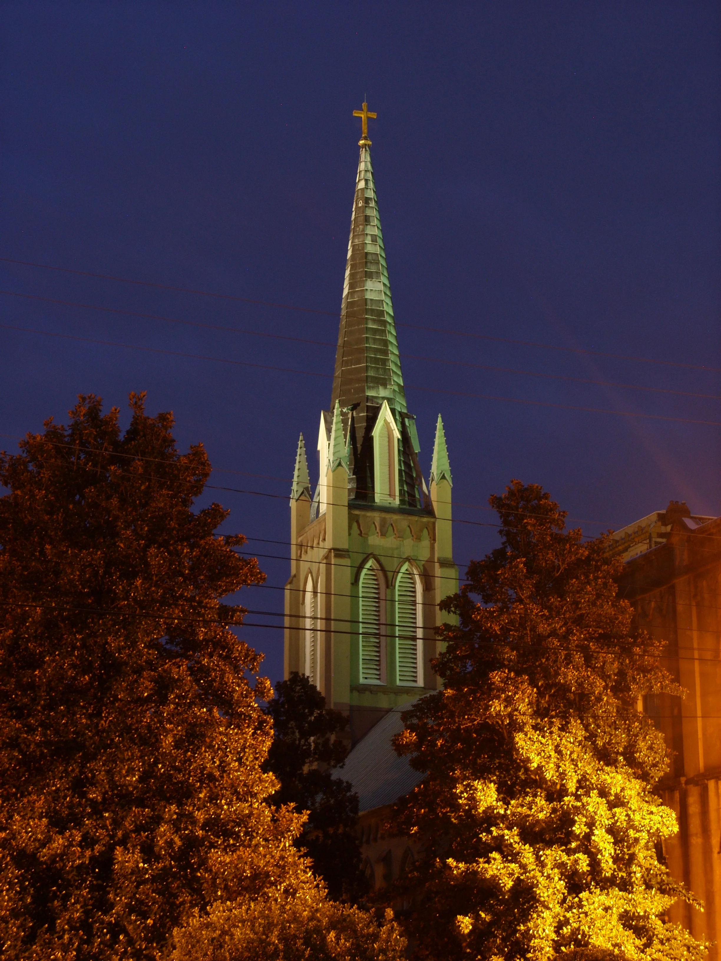  A nighttime shot of the steeple of St. John's Episcopal Church. 