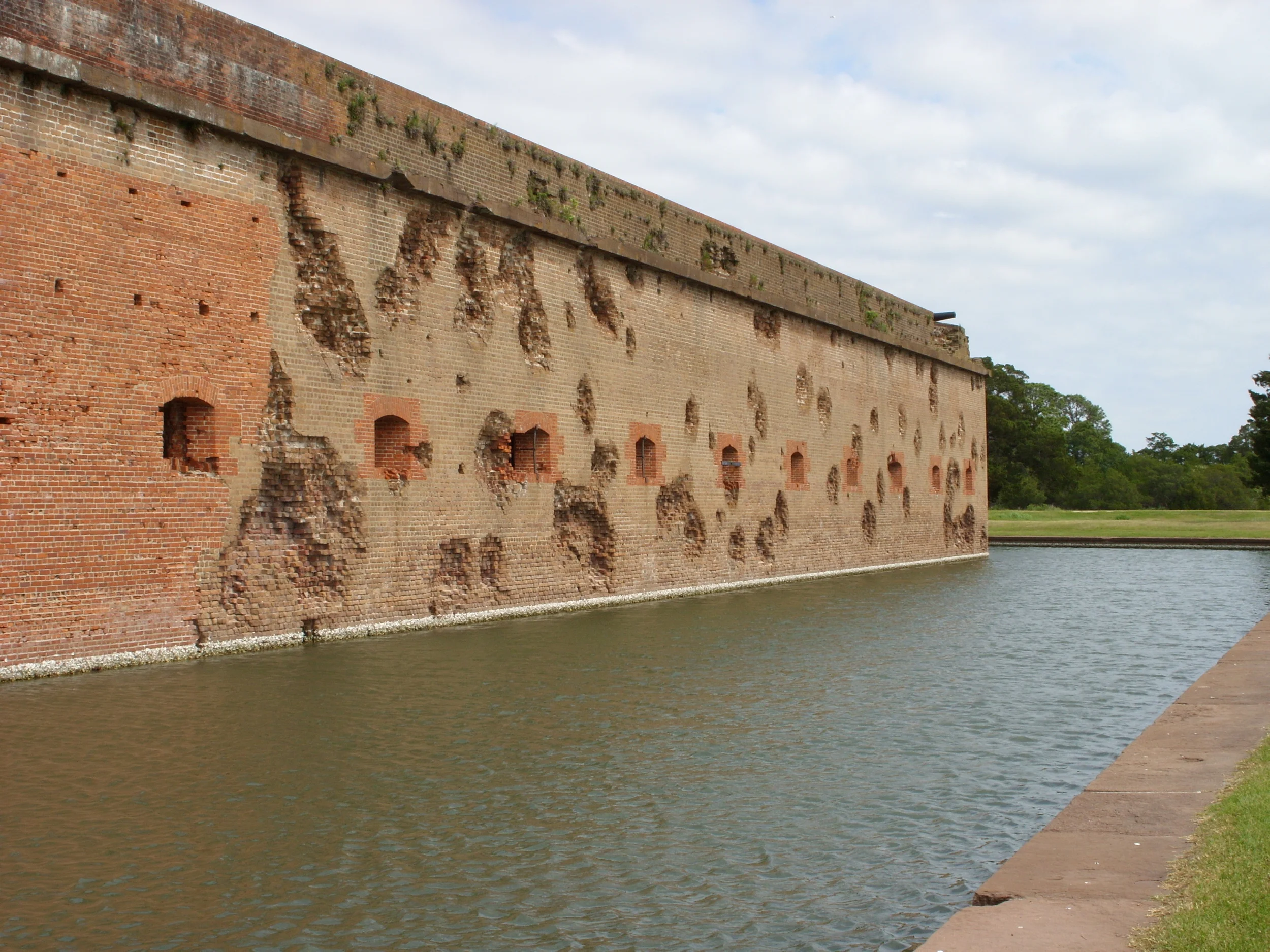  The moat and a battered wall 