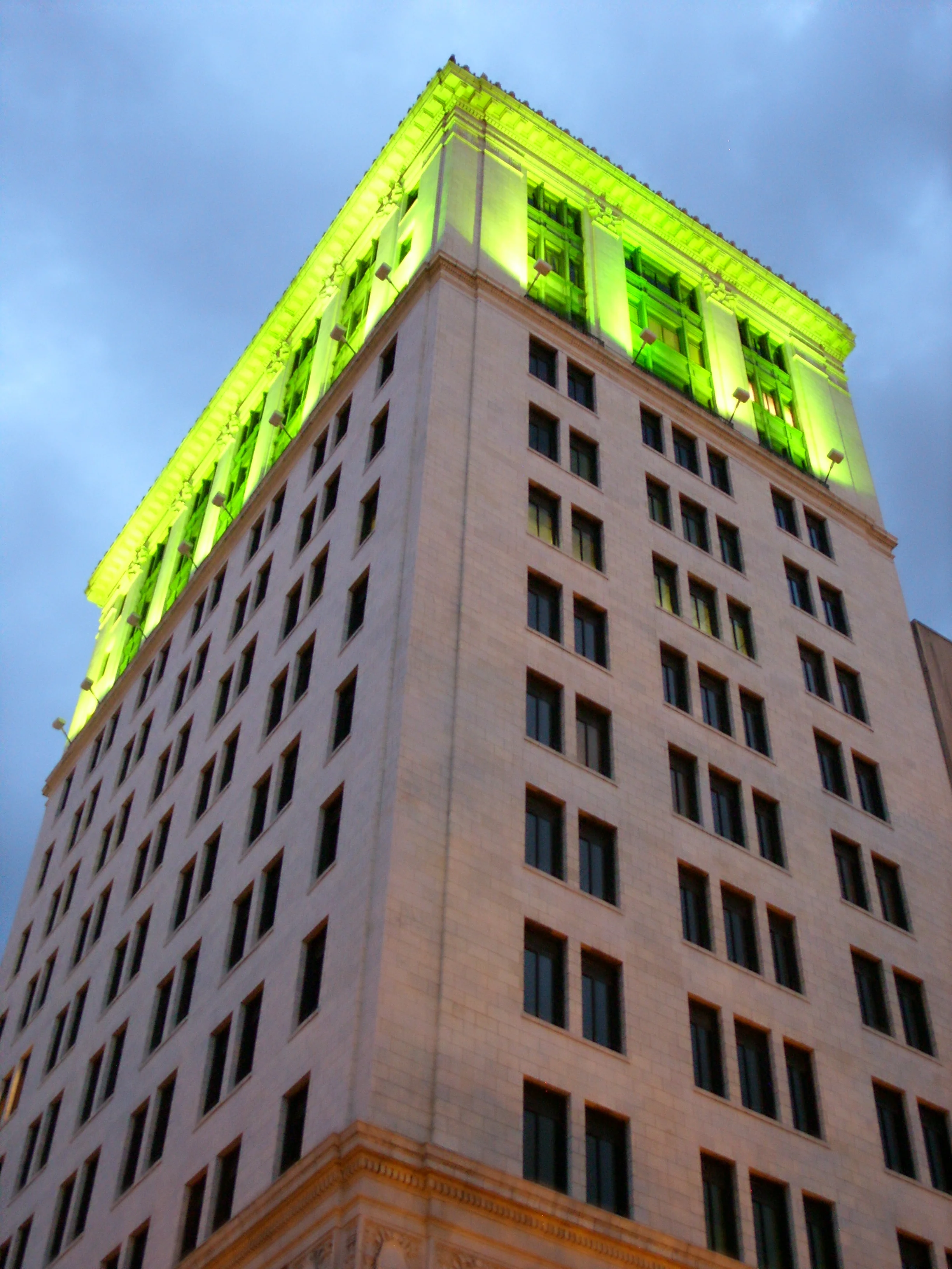  A skyscraper next to Johnson Square lit up green for St. Paddy's 