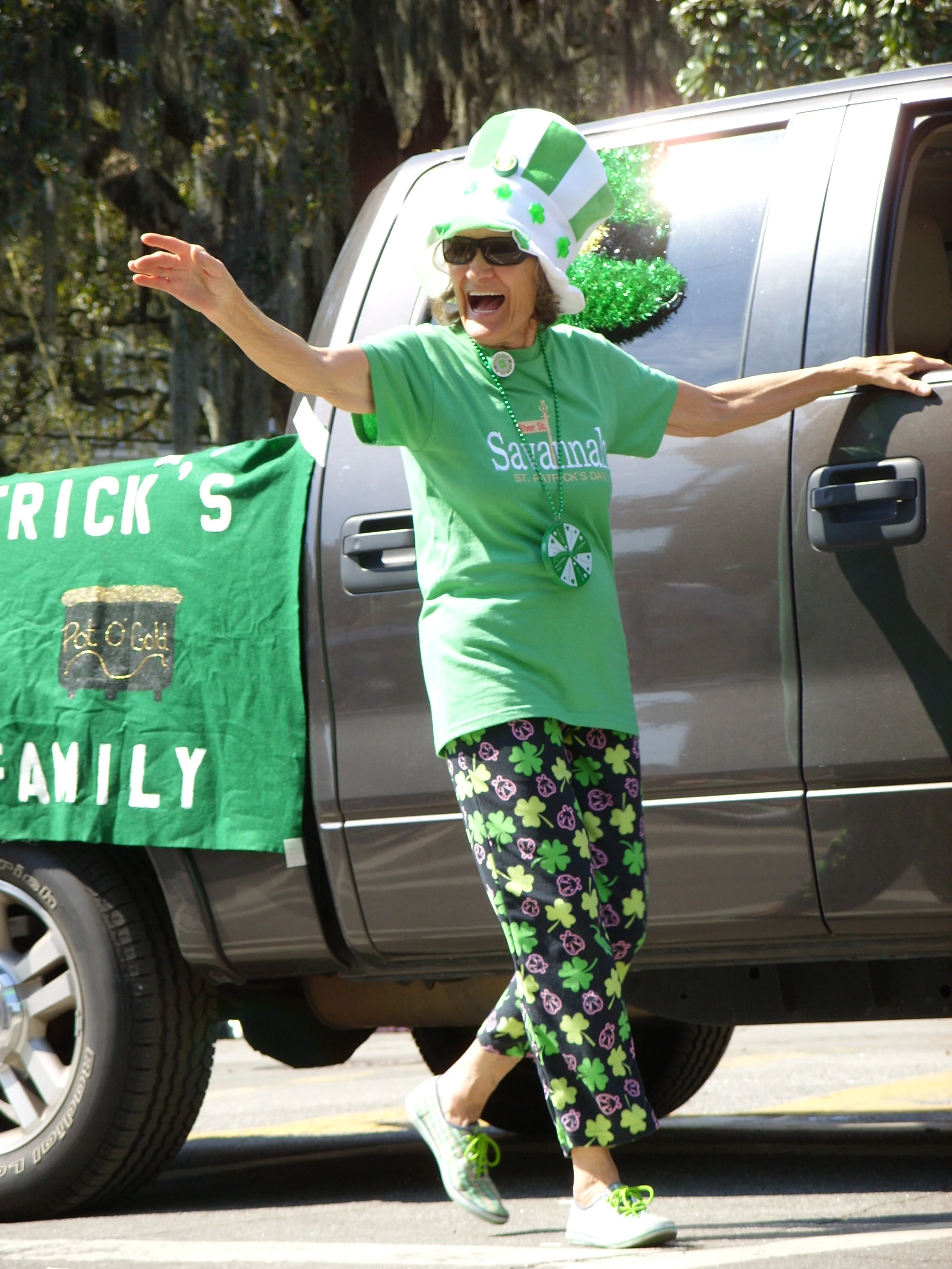  A lady marching in the parade with her family 