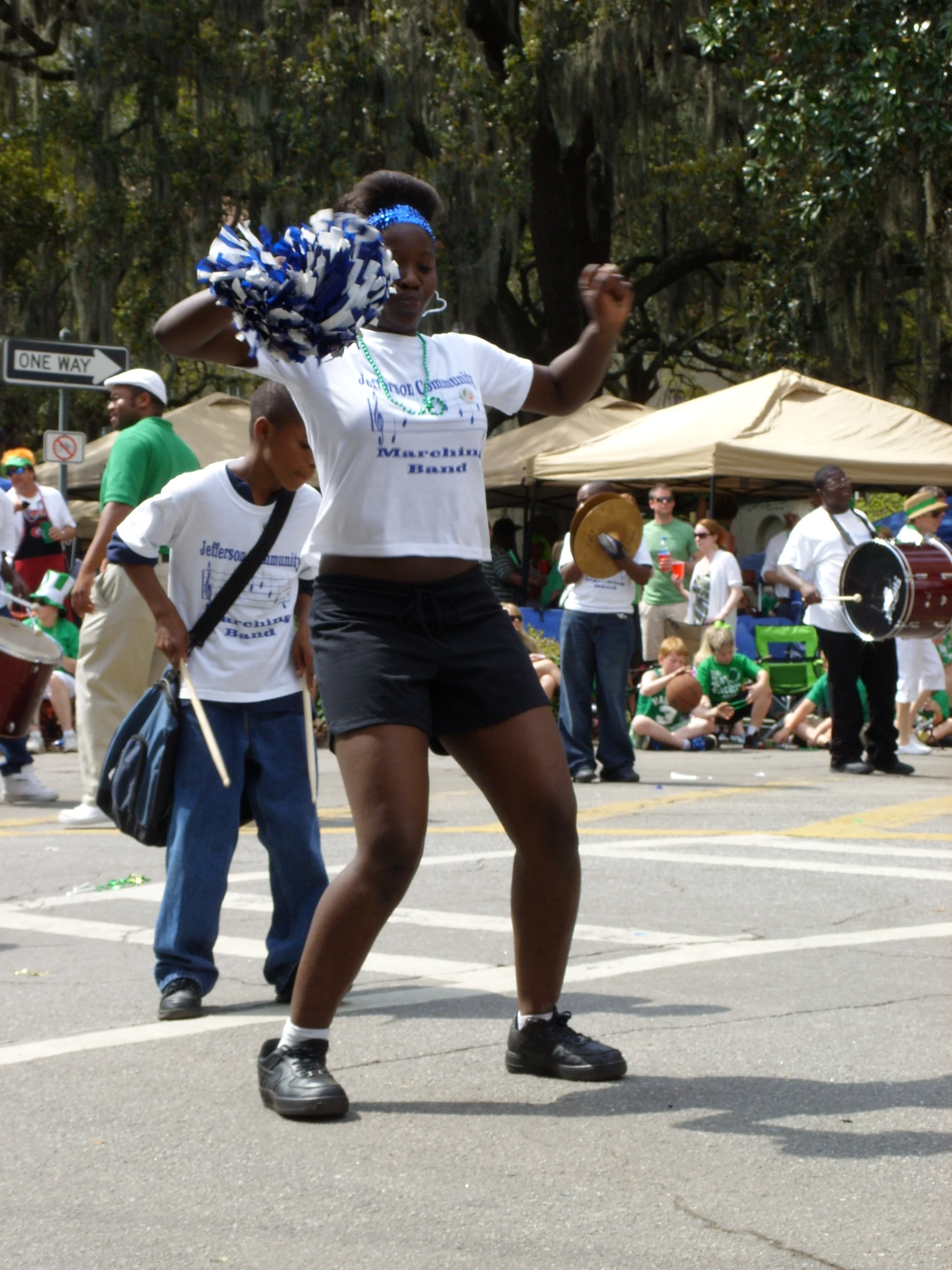  A troop of middle school cheerleaders marching in the parde 