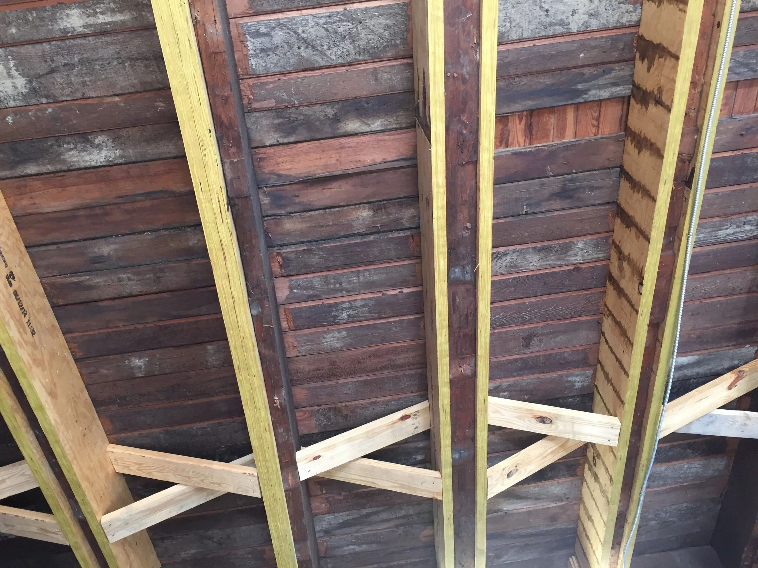 Old ceiling beams reinforced with new wood.