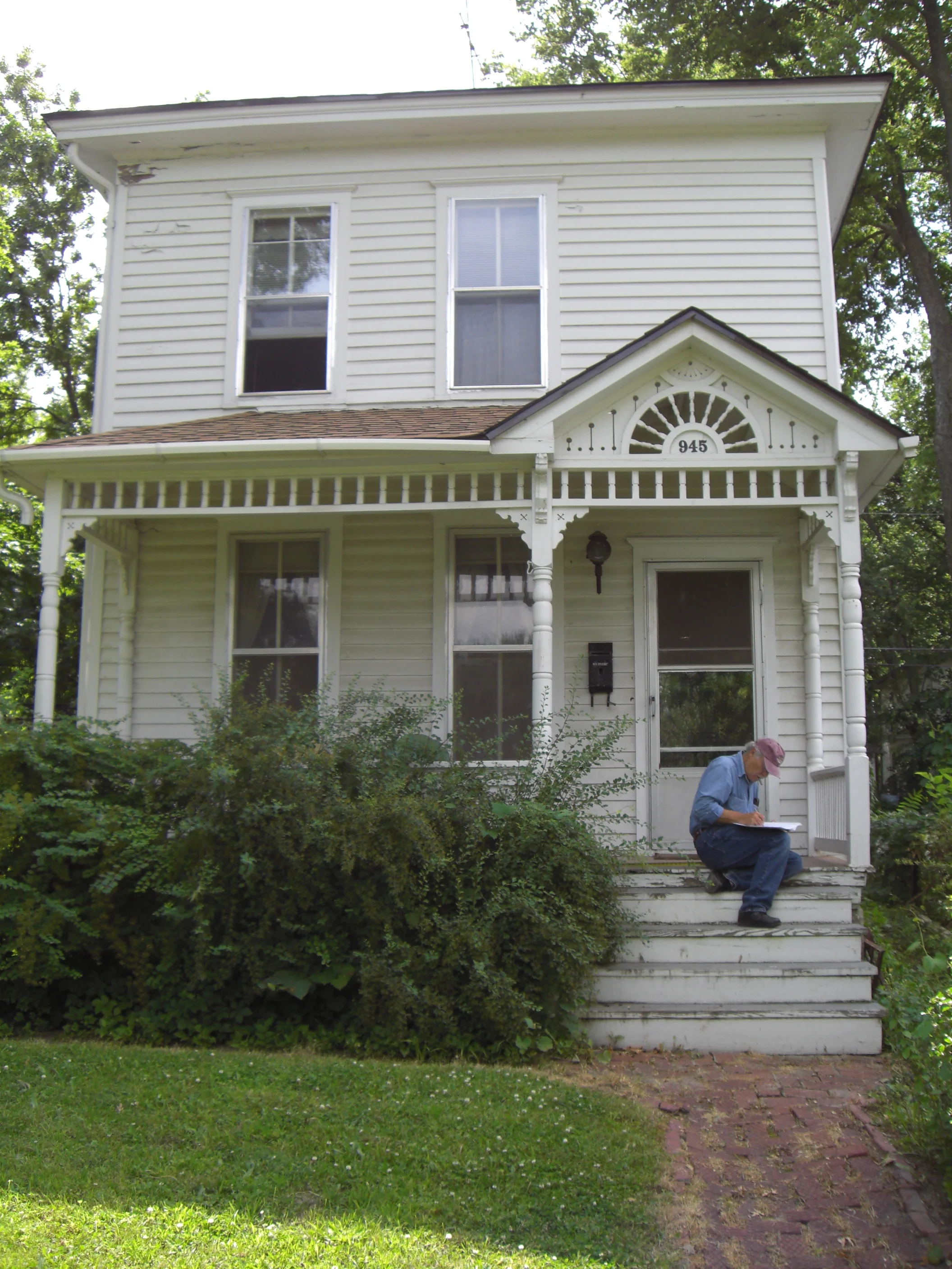 945 Delaware St. - Dennis Domer writes down notes on the architecture of the William H. Schell House, listed on the Lawrence Register of Historic Places