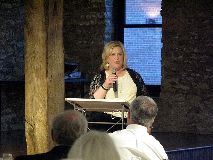 Assistant city manager diane stoddard accepts the lPa preservation achievement award for her work in helping to preserve the Amtrak depot in Lawrence.