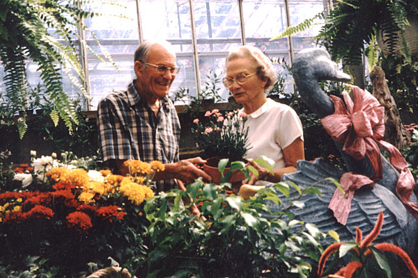   Ted and Frances visit in the greenhouse which played such an important part of their lives.  