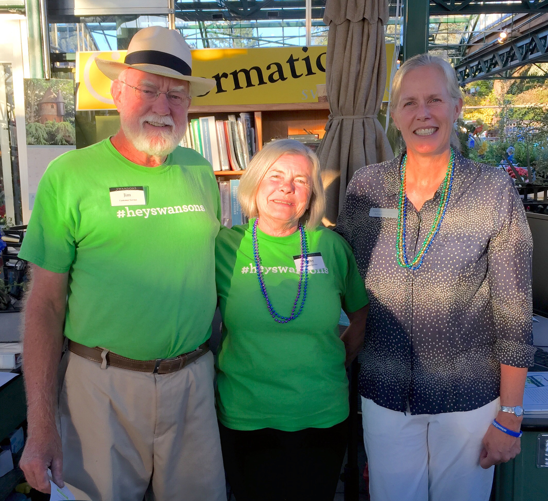  Swansons' employees Jim Woods and Kathy Cooper with Food Bank Board Director Rebecca Butler. 