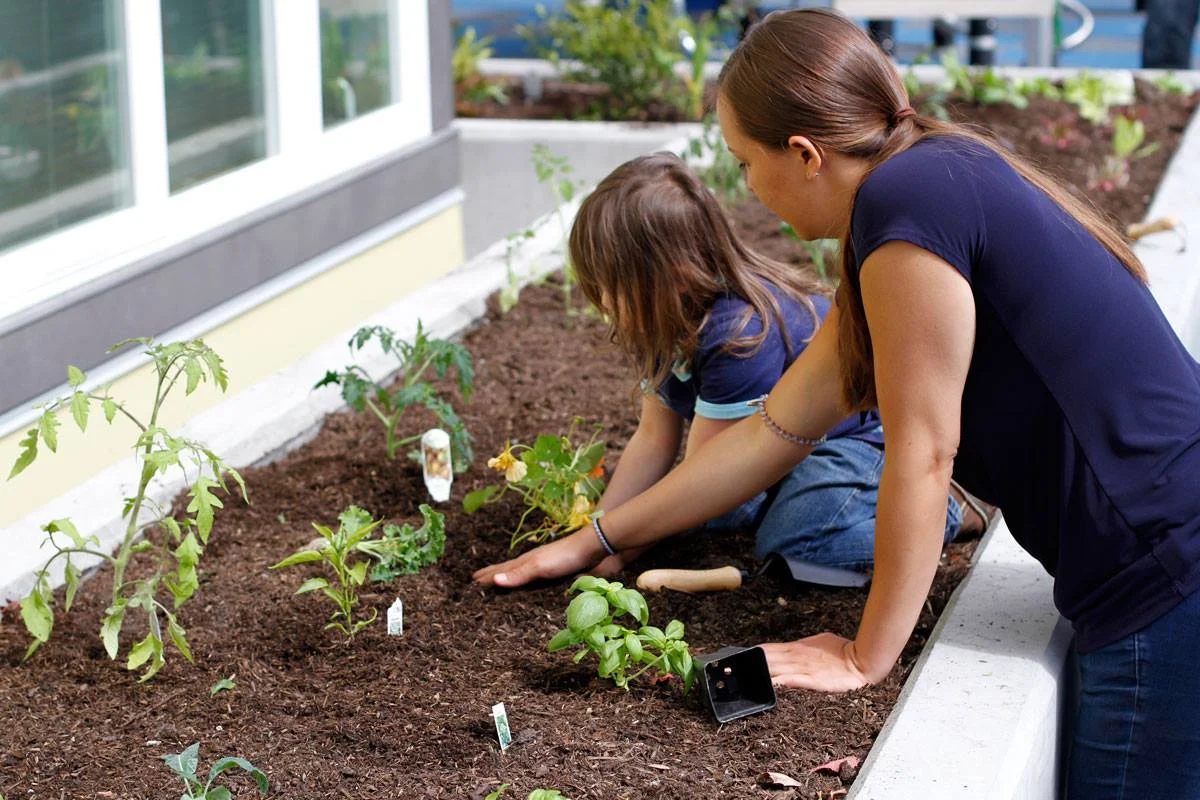 girl and woman planting veggies.jpg