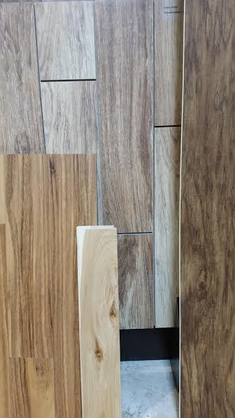 From left to right LVP, solid wood, porcelain, and WPC