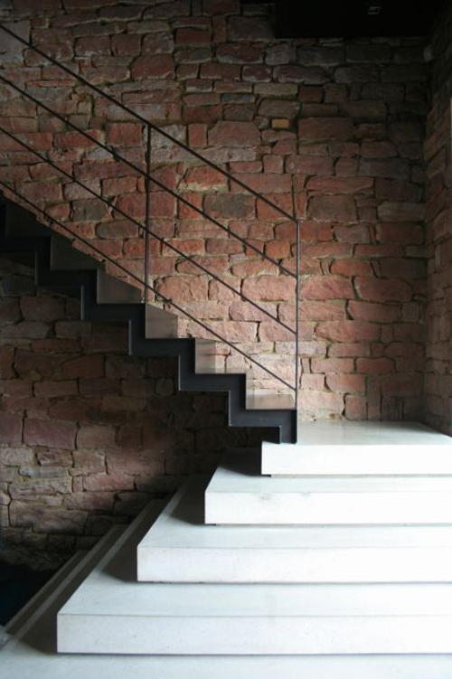 This staircase by Jurgen Mayer, with a minimalist approach to the same material, does at least three things well. Firstly, It's employed as more than just a staircase, it's also a sculpture. Secondly, the sculpture empl