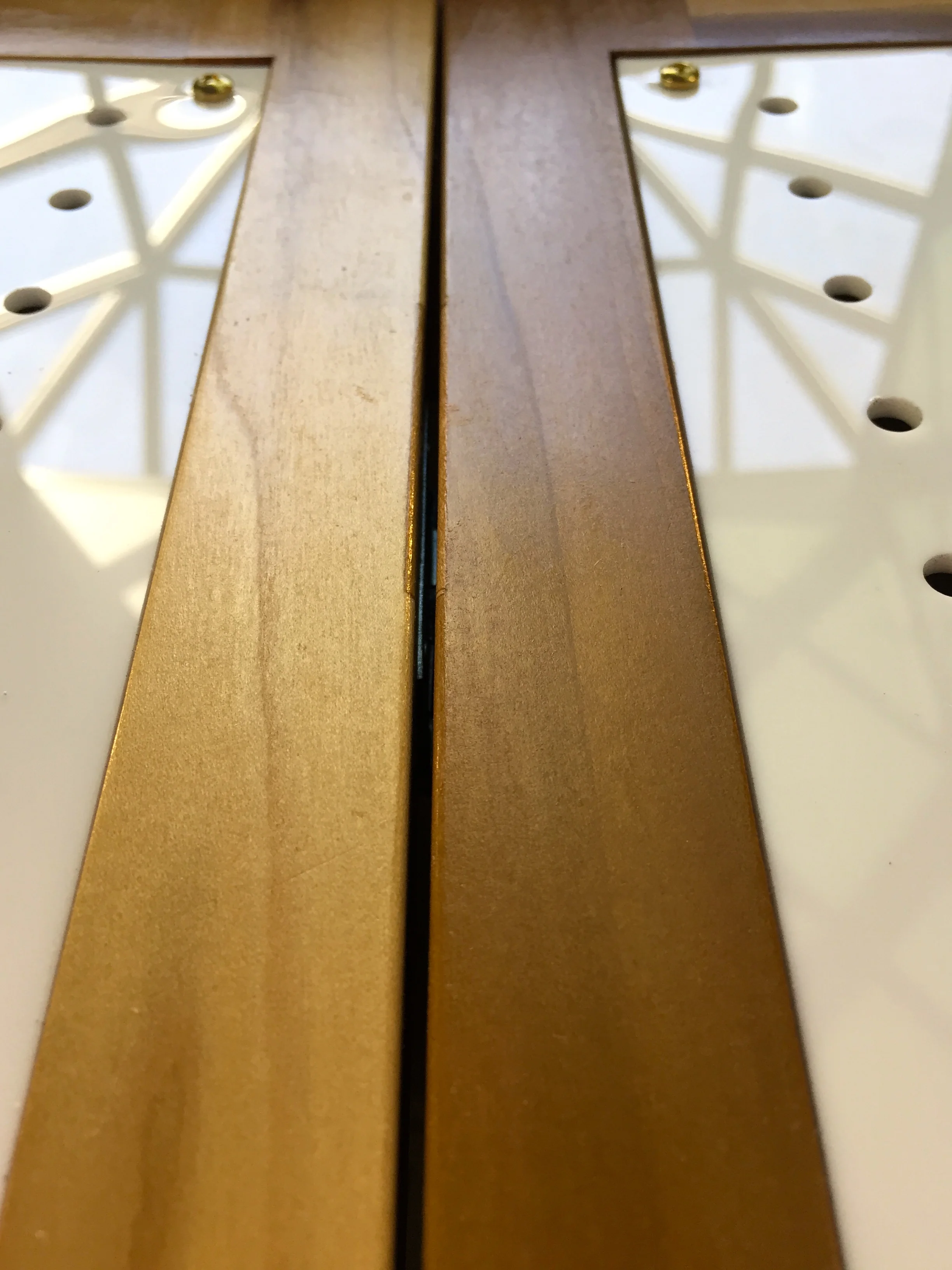 CUSTOM LAUNDRY ROOM DOORS - perforated plexi+oak