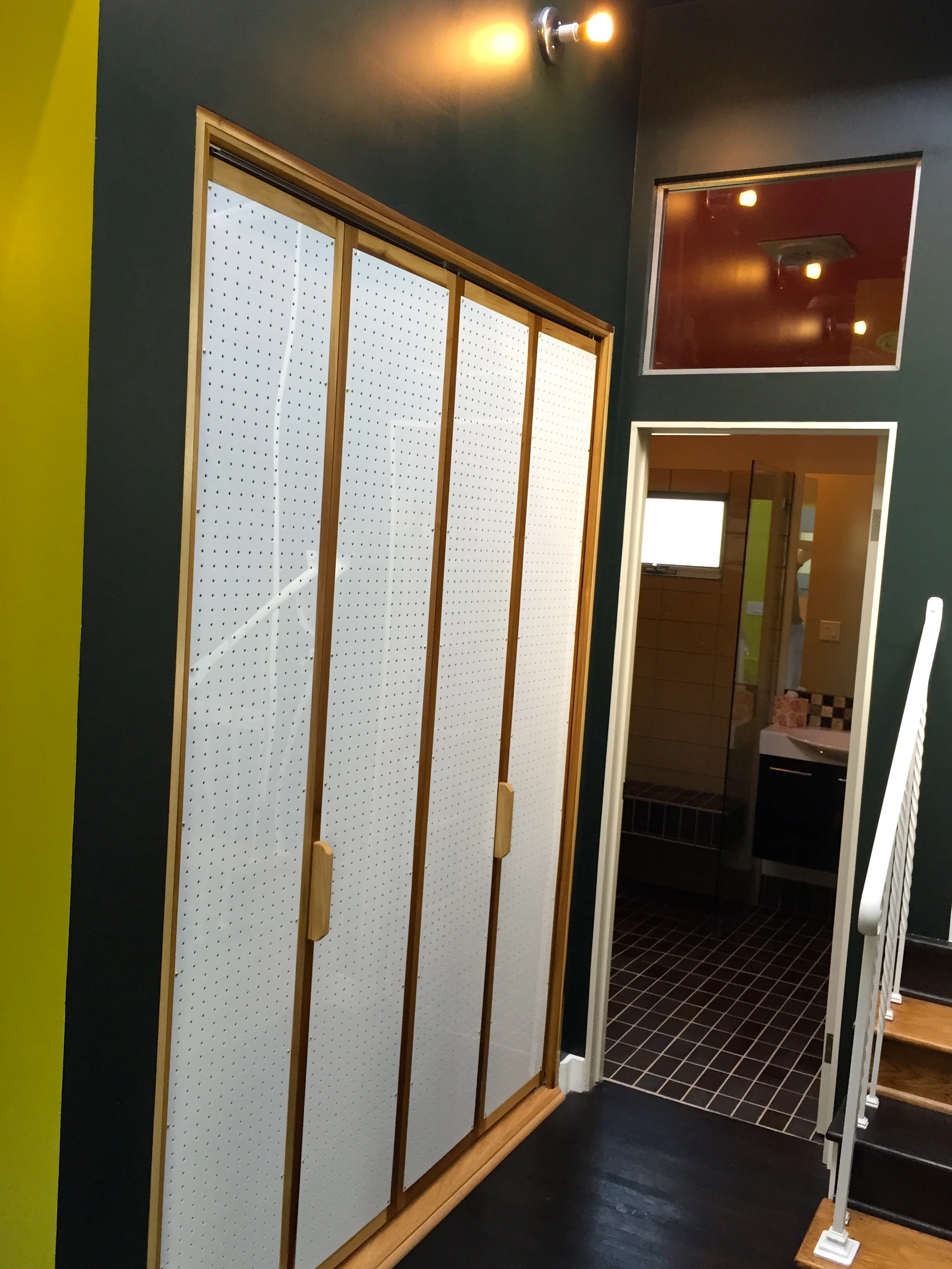 CUSTOM LAUNDRY ROOM DOORS - perforated plexi+oak