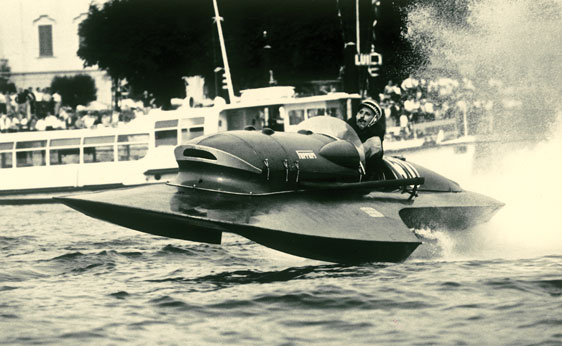 RM Auctions - Period shot of one of the racers crazy enough to pilot these at speed.