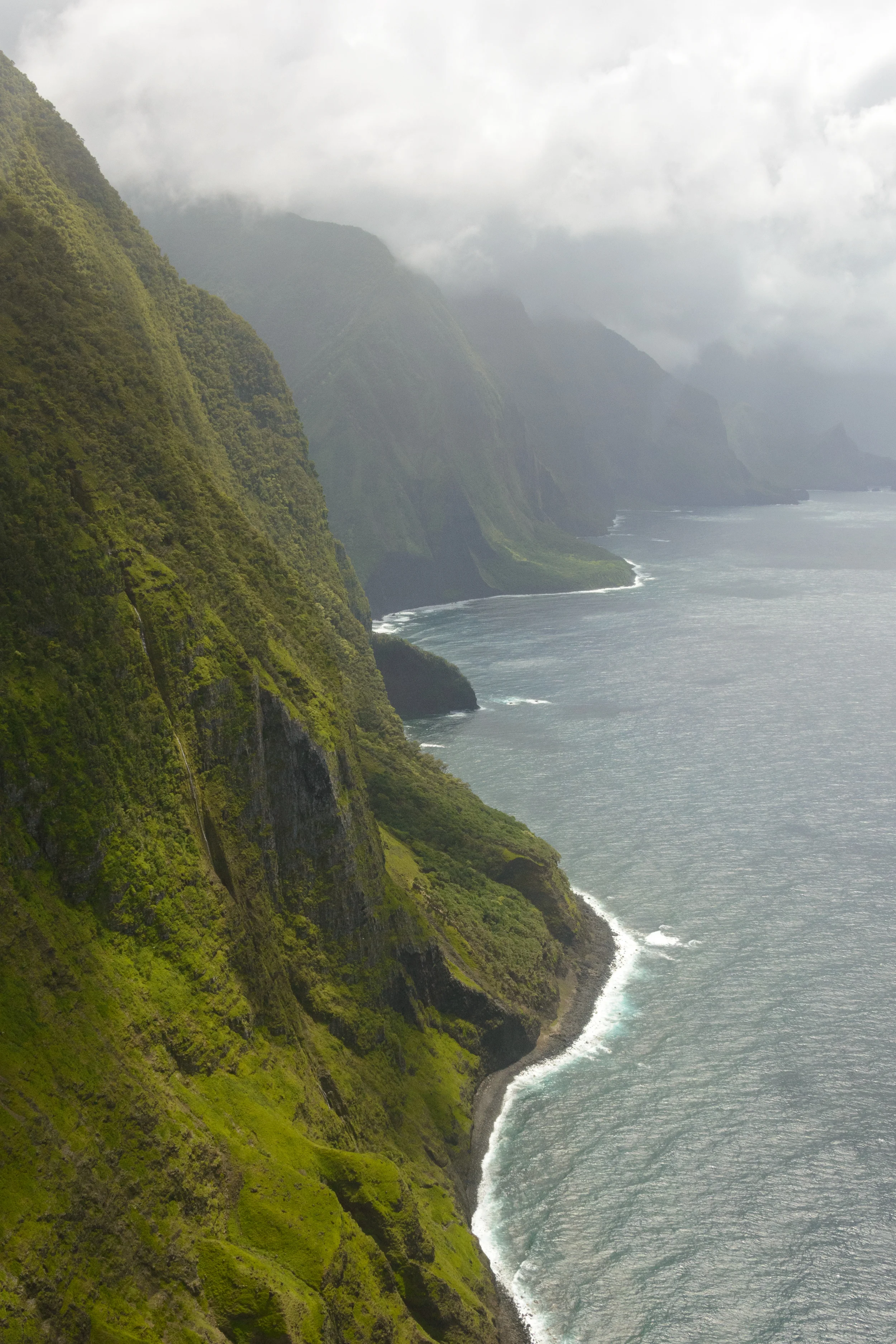 An aerial view of the windward Molokai coastline, taken from a helicopter as it approached from Maui