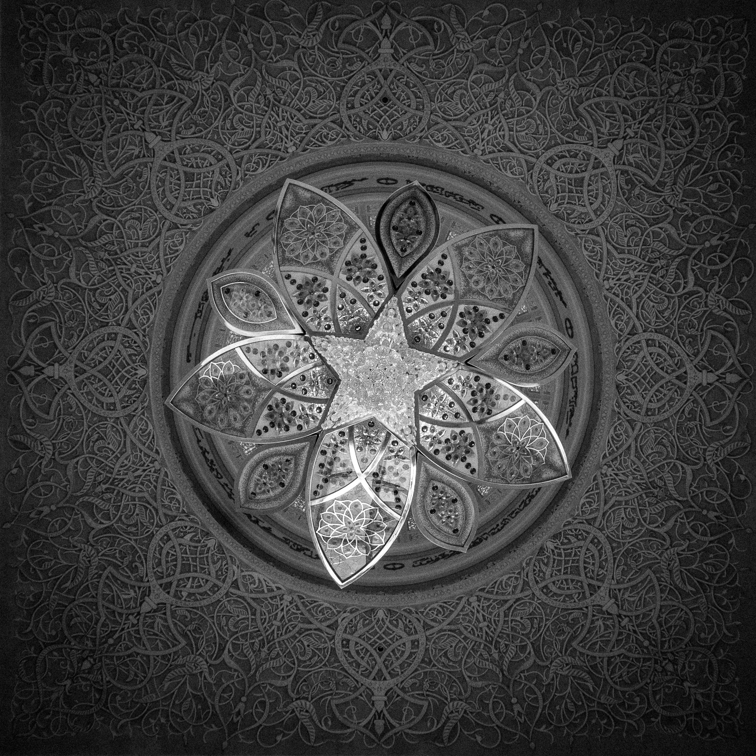 The ceiling and one of the intricate chandeliers at Abu Dhabi's Grand Mosque
