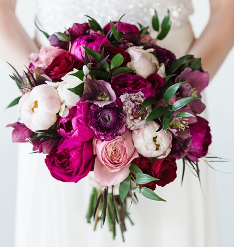 mixes pale pink, magenta, and burgundy peonies, roses, and ranunculus..jpg