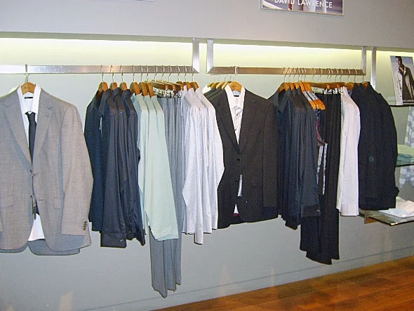 Merchandising menswear for a higher end brand. 3 of each item are on display.