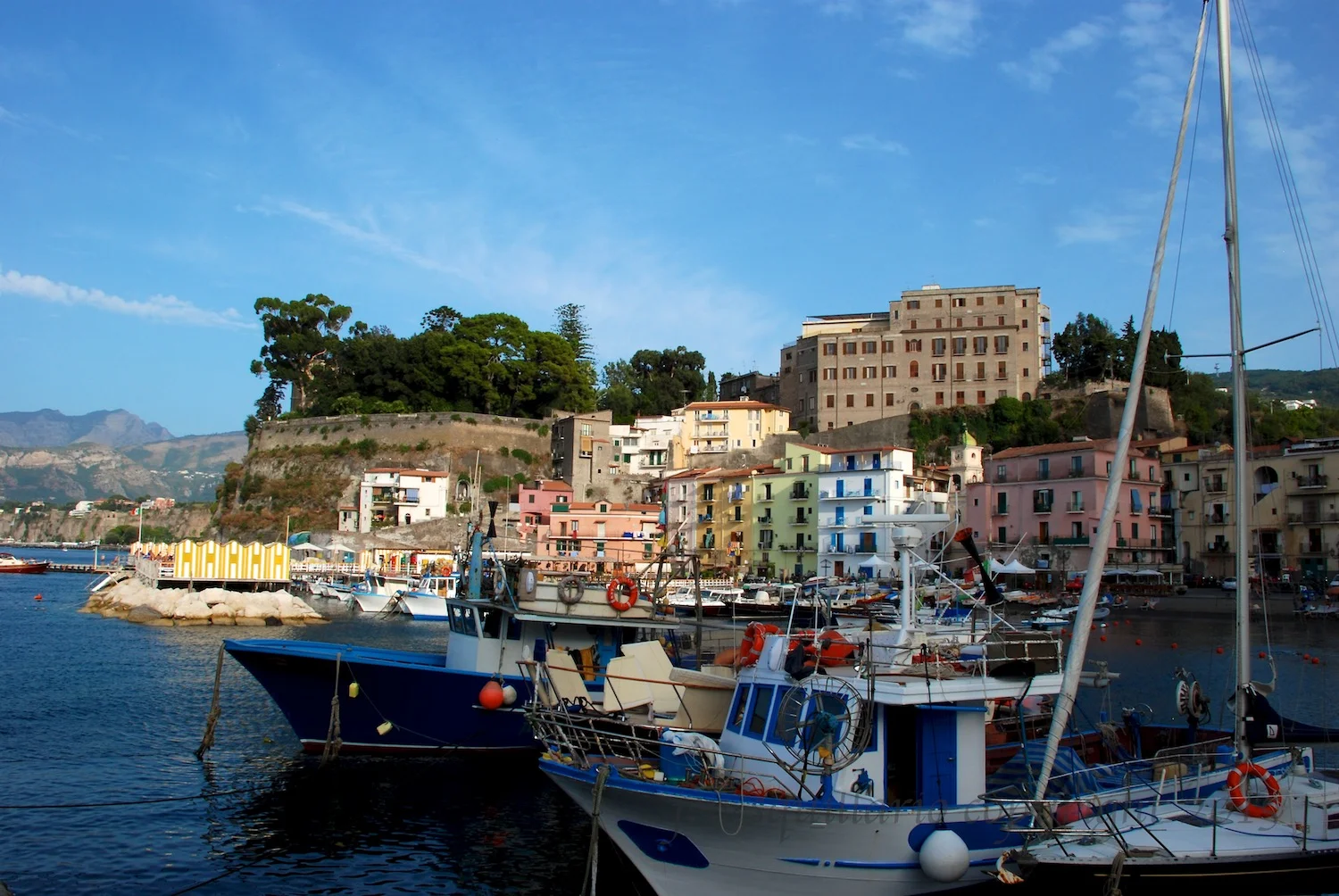 The view of the fishing village in Sorrento, Italy. Sorrento is a good starting point and/or home base when exploring the Amalfi Coast. The pizza here is great, and there are streets with shops and restaurants to explore for hours.