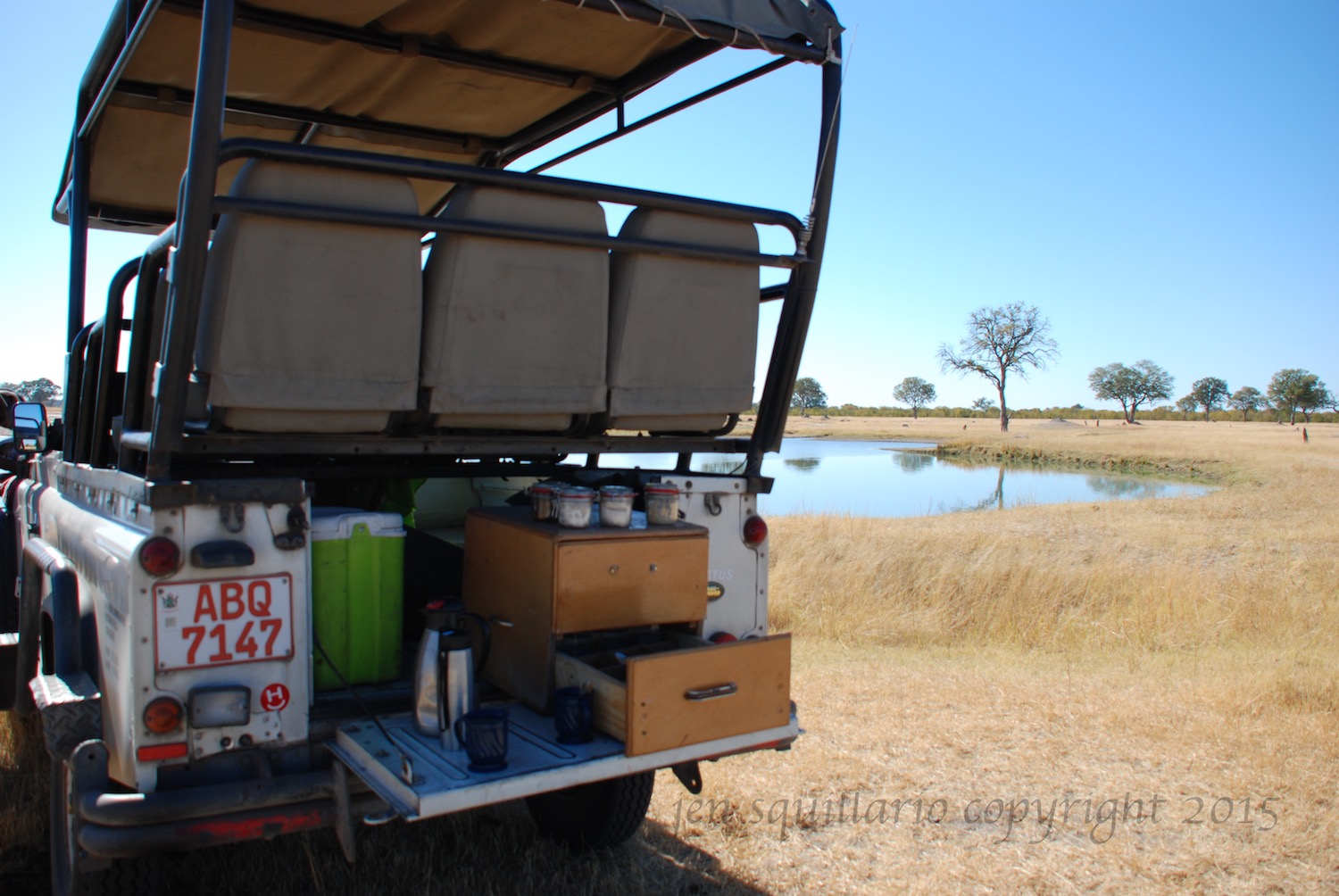 Our safari vehicle on our photographic safari in the Hwange National Park in Zimbabwe in June (winter in Zimbabwe). The back of the vehicle is set up for morning coffee and tea. See www.wilderness-safaris.com for more information.