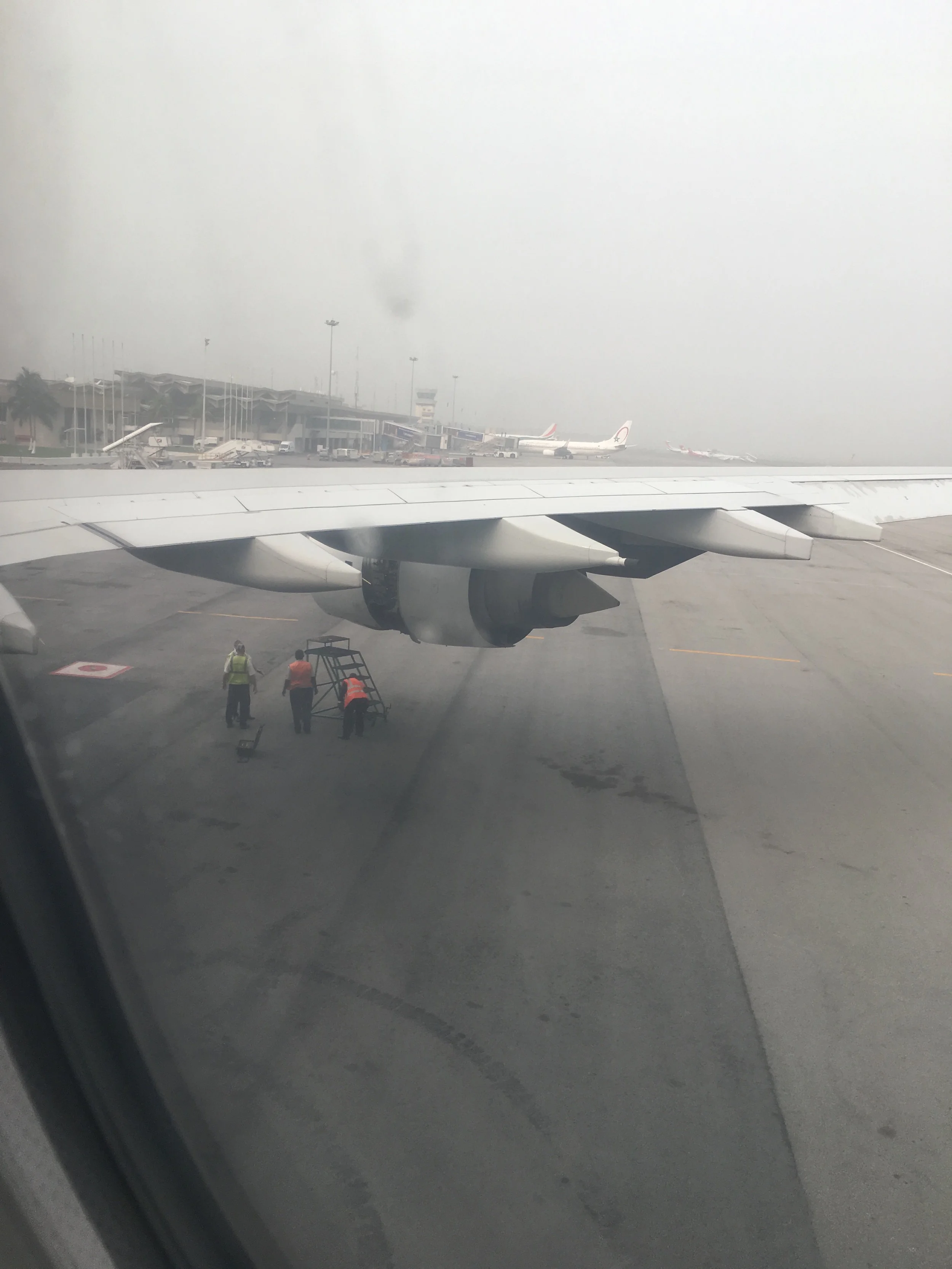 One of the only photos taken of the ordeal. Ian took it with his iPhone through the window of the airplane as we watched the ground crew fix one of the engines. In hindsight, we should have taken more photos. But, at the time, we couldn't get past the stress of the situation.