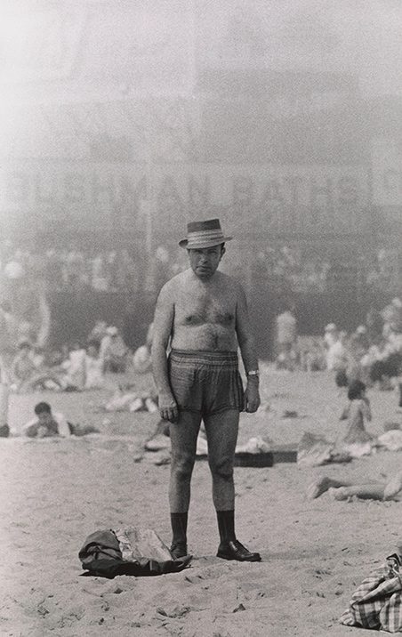 Arbus, Diane. Man in hat, trunks, socks and shoes, Coney Island, N.Y. 1960.