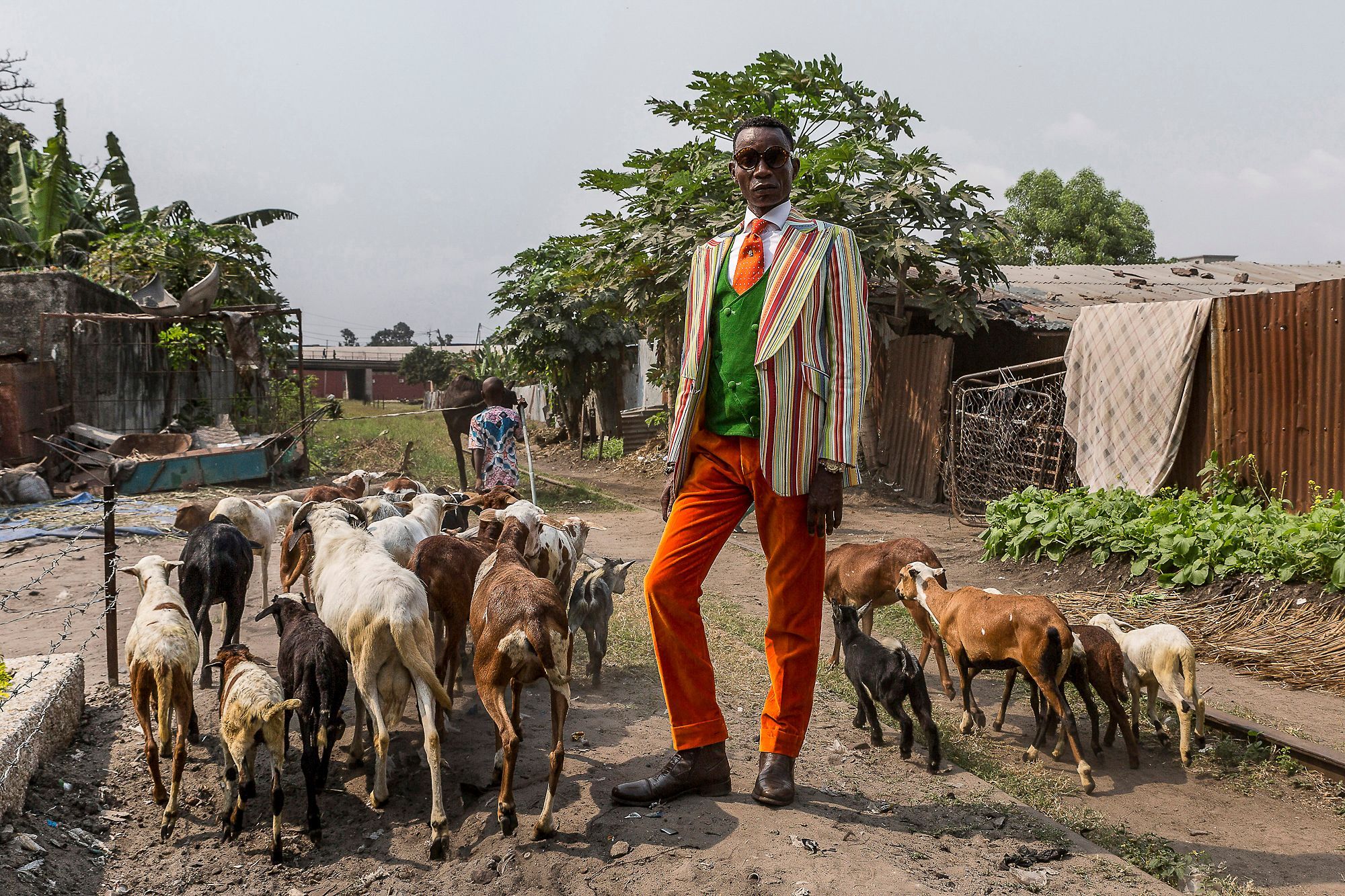 Maxim, 43, has been a sapeur since he was seven years old. He mixes labels such as Yves Saint Laurent, Pierre Cardin and Christian Dior with suits that he has designed and made himself. Now married with two children, he teaches others the art of how to dress elegantly. Brazzaville, Republic of the Congo. Tariq Zaidi
