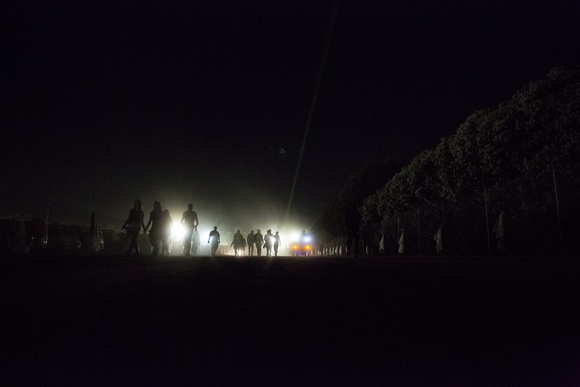 Festival-goers walk through the grounds on Friday night weekend two at Coachella.