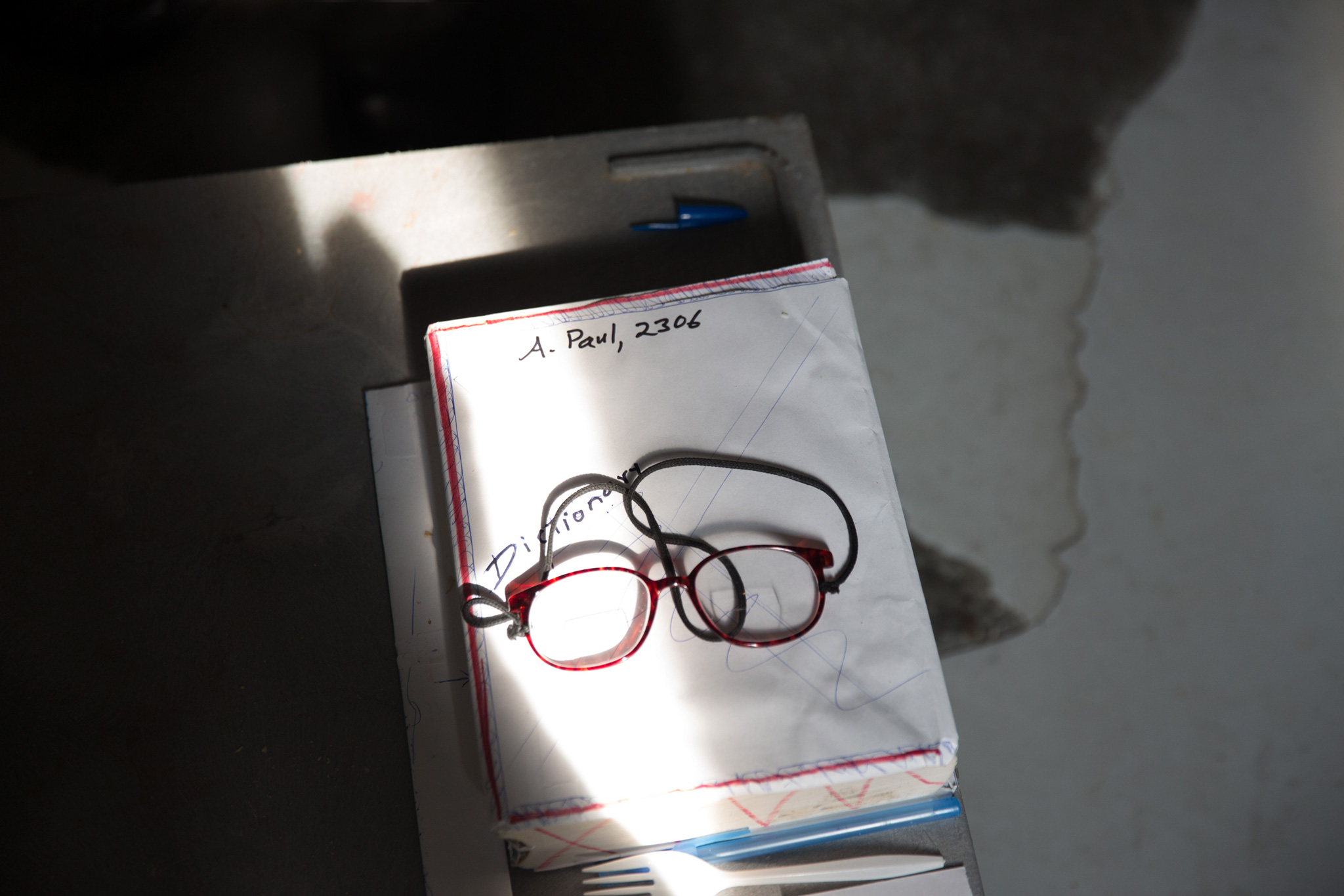 Albert's cell has notes and pieces of writing everywhere. He once spent ten years in solitary confinement, which he said he got through by reading, writing and designing a house.