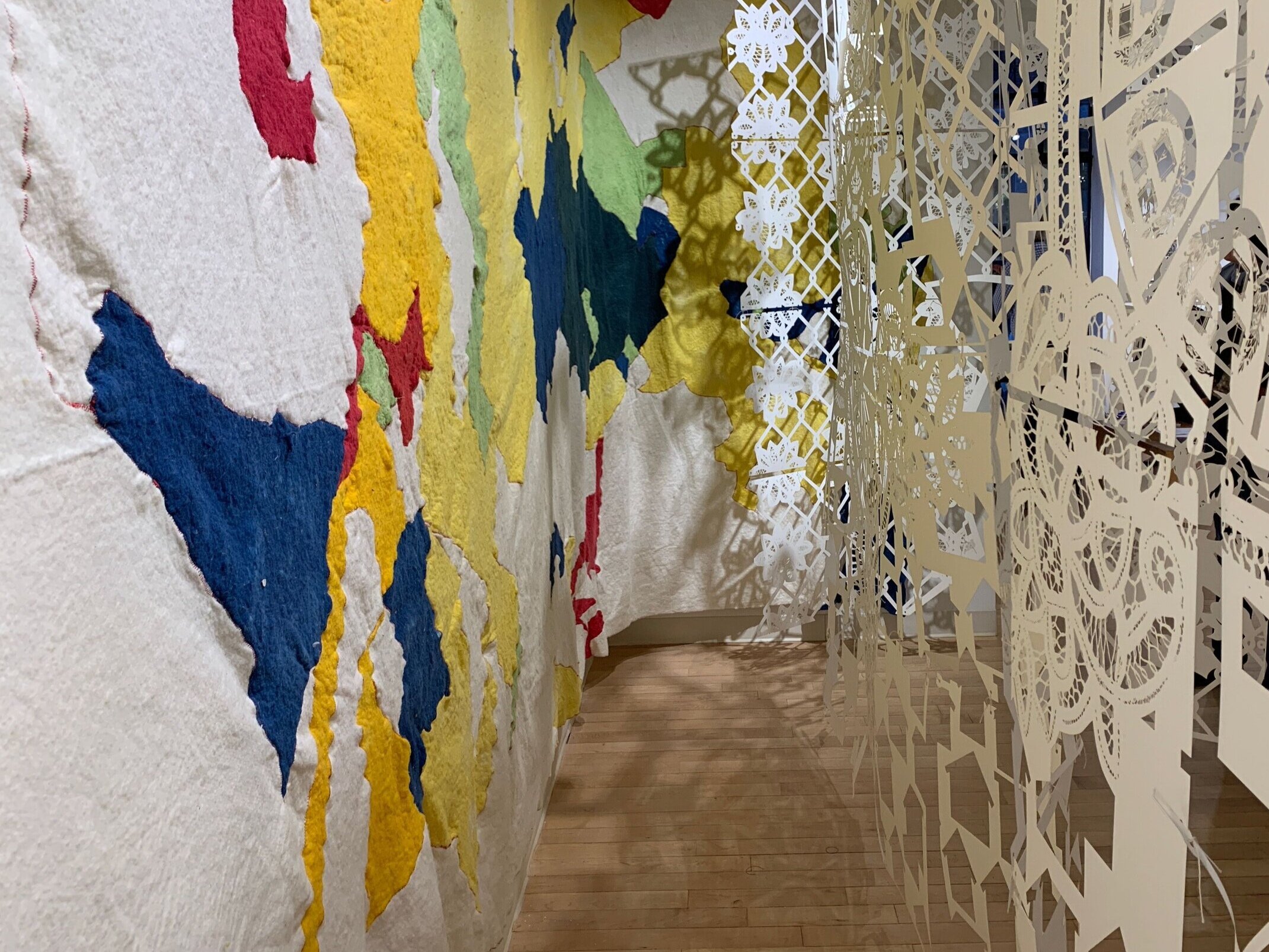 The left wall shows part of the enlarged redline map of Greater Boston. The map is made from hand dyed cotton batting.