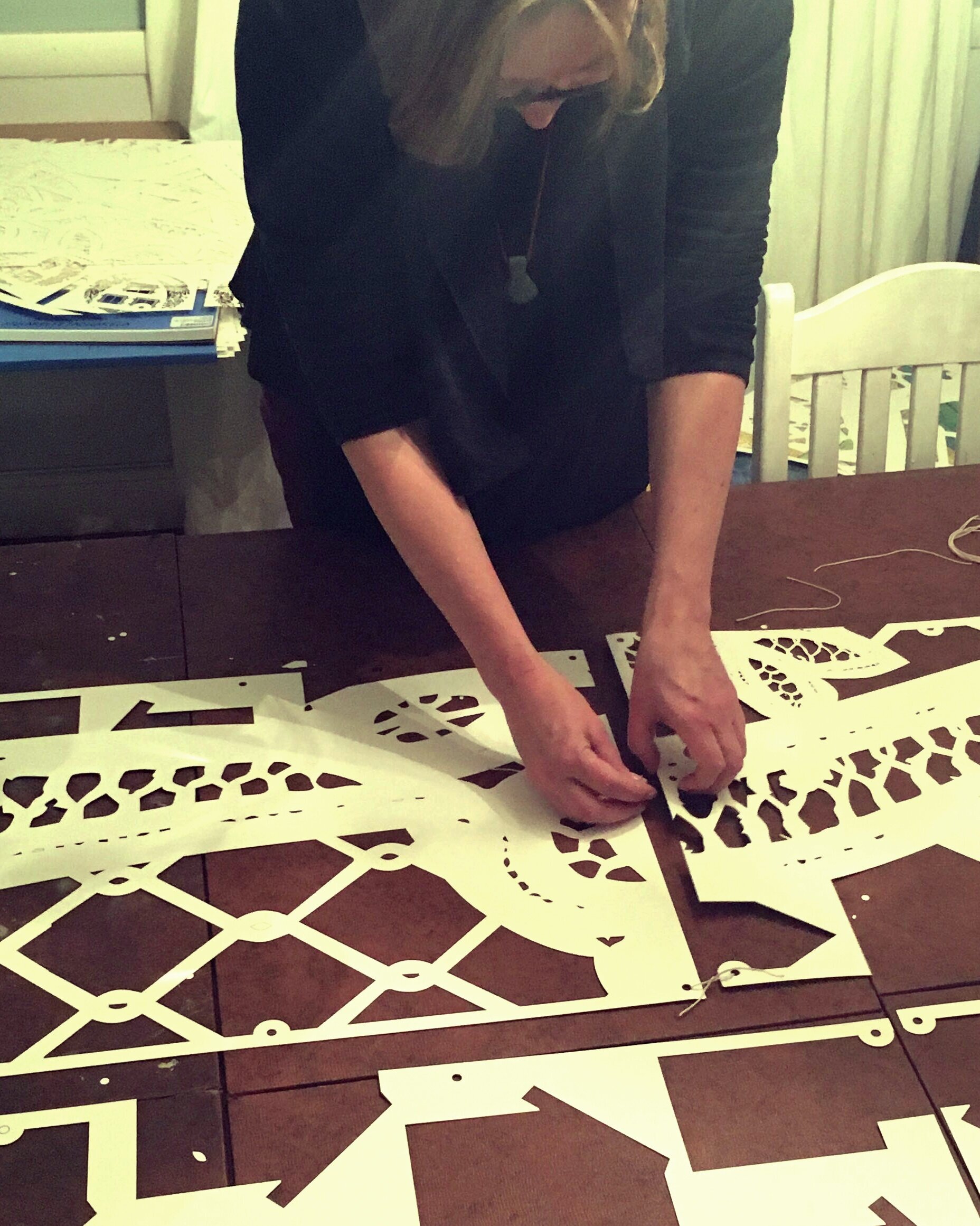 Piecing the walls together before bringing them to the gallery. Each panel is attached using cotton string.