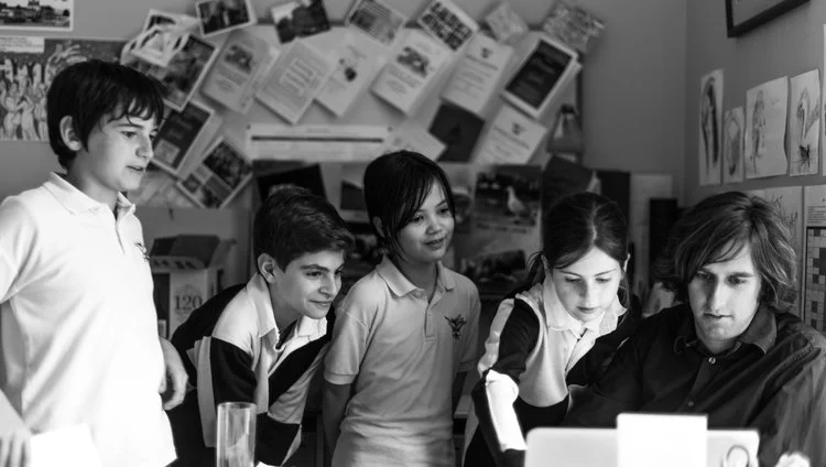 Adam D’Souza with some of his pupils at Hampton Court House. Photograph by Diana Patient
