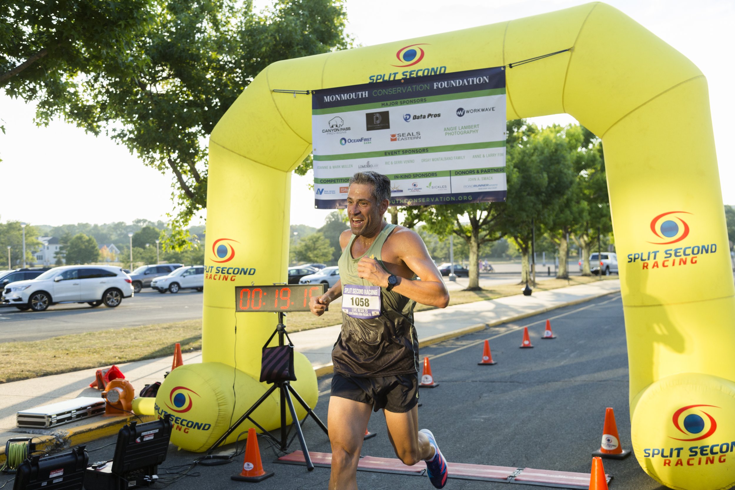 Runner coming through Finish Line 1058.jpg