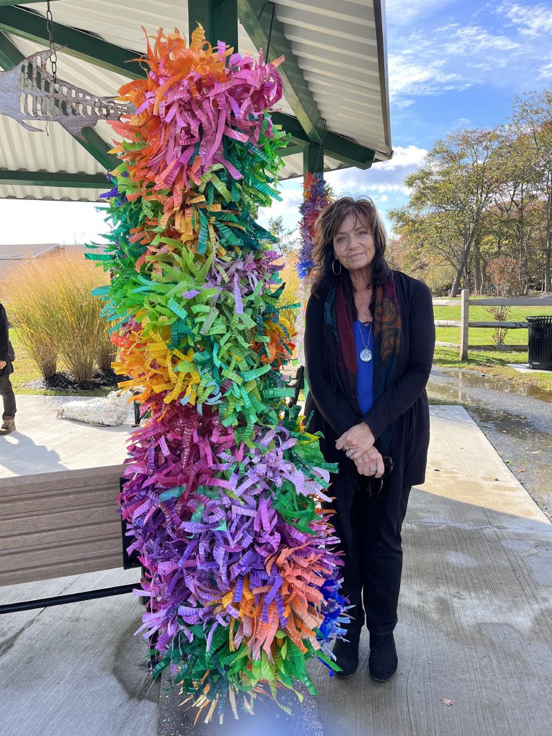   Carla Valentino with her piece made from found plastic bottles  