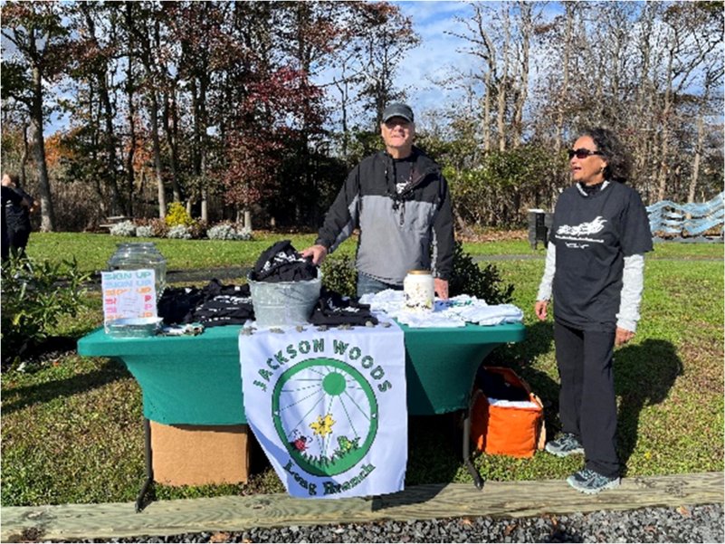   Friends of Jackson Woods volunteers distributing commemorative t-shirts and educational literature   